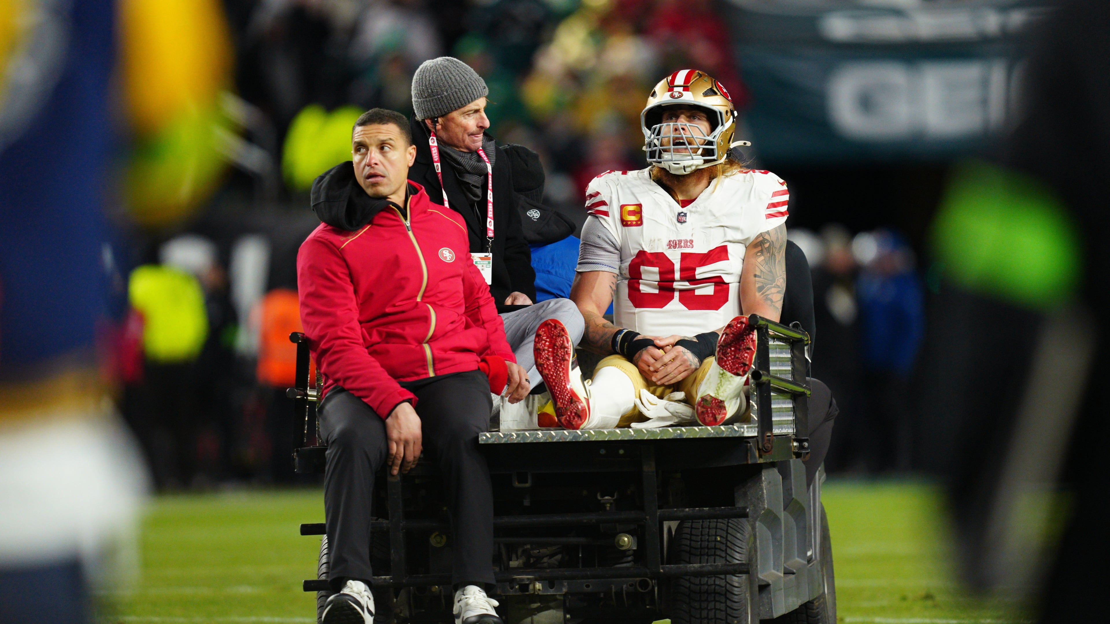 San Francisco 49ers tight end George Kittle (85) is carted off the field after an injury during the first half of an NFL wild-card playoff football game against the Philadelphia Eagles on Sunday, Jan. 11, 2026, in Philadelphia. (AP Photo/Derik Hamilton)