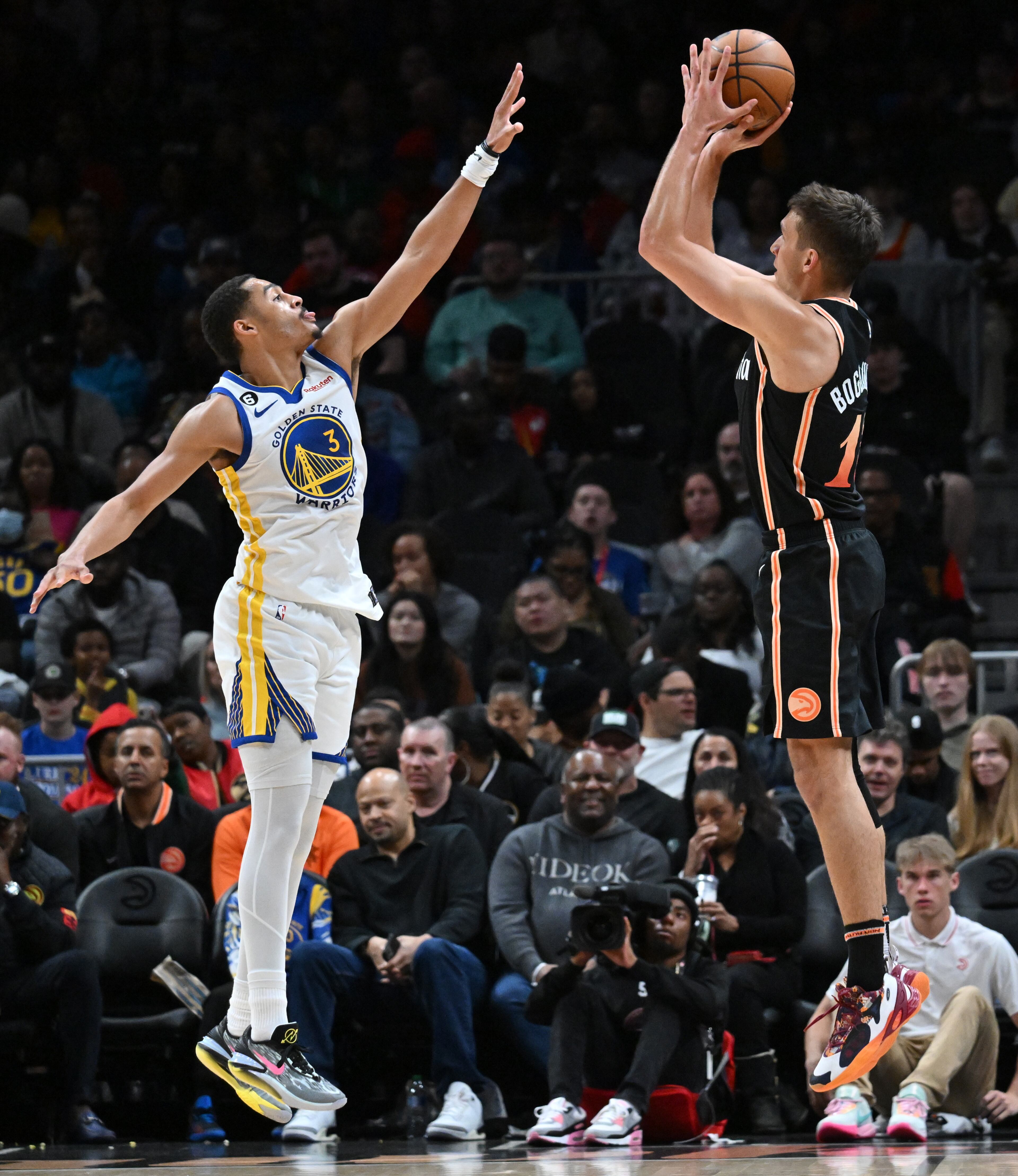 Atlanta Hawks' guard Bogdan Bogdanovic (13) shoots over Golden State Warriors' guard Jordan Poole (3). (Hyosub Shin / Hyosub.Shin@ajc.com)