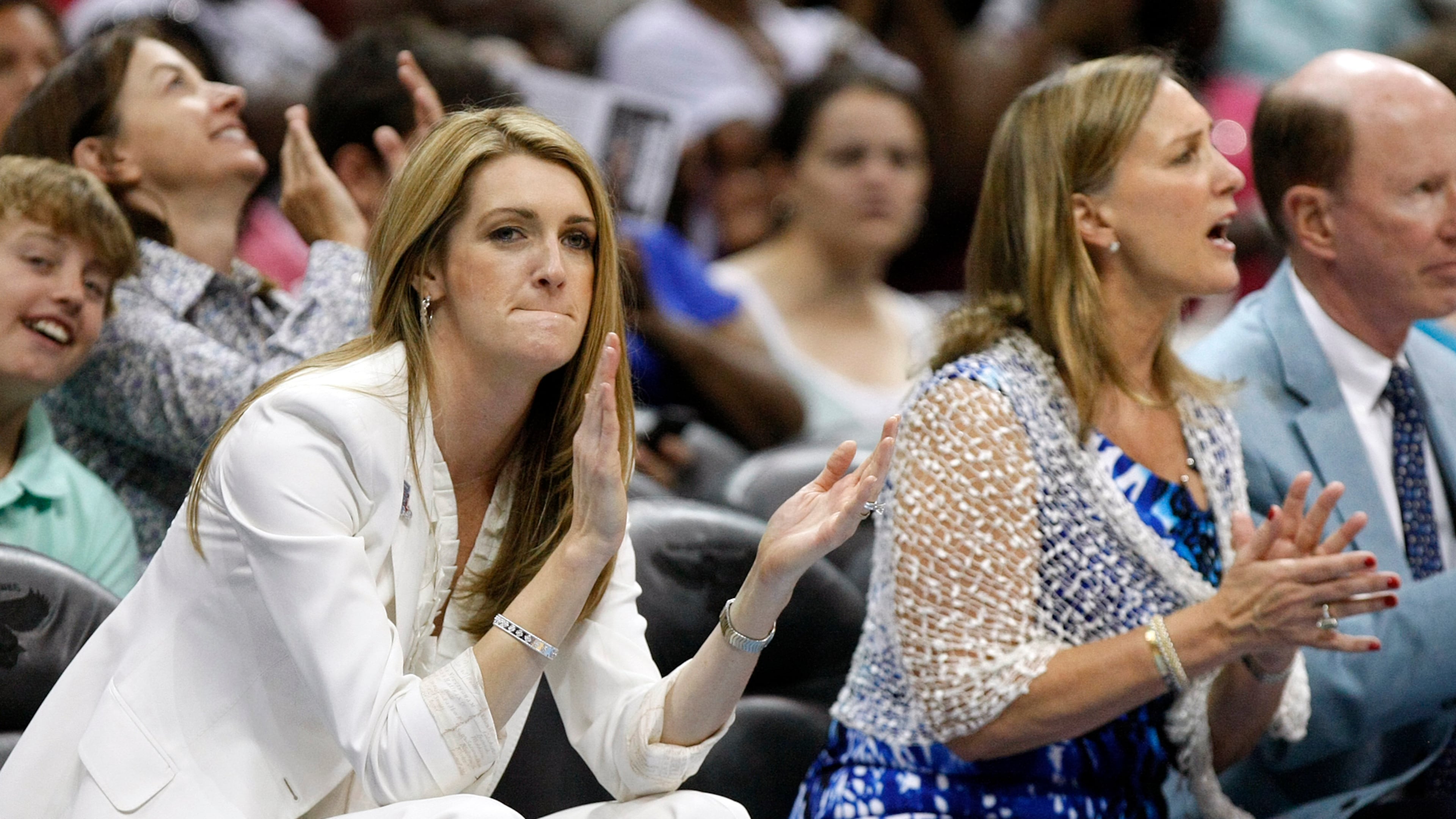 110605 Atlanta - The newly expanded Dream ownership group now includes Kelly Loeffler, left, and Mary Brock, right, cheering their team in 2nd half action against New York at Philips Arena in Atlanta on Sunday, June 5, 2011. Curtis Compton ccompton@ajc.com