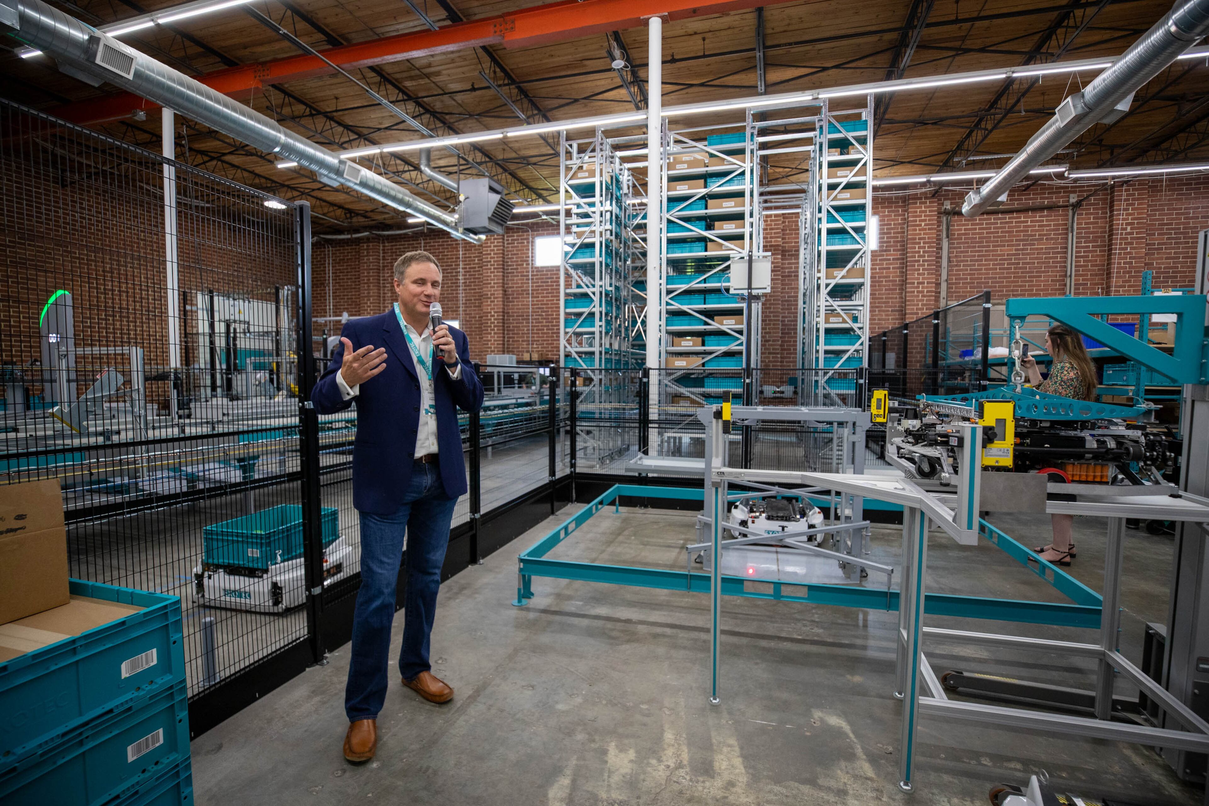 Andy Williams shows the demonstration room of Exotec’s new headquarters in Atlanta on Thursday, June 15, 2023. (Katelyn Myrick/katelyn.myrick@ajc.com)