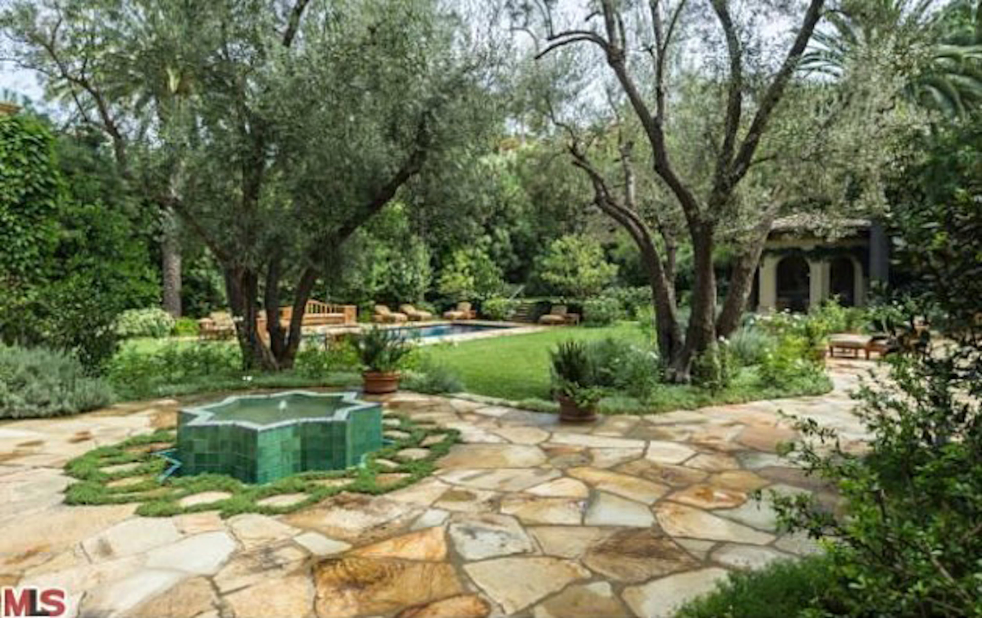 Take a peek inside Christina Aguilera's Beverly Hills mansion. The home, which Aguilera bought for $10.75 million in 2013, features six bedrooms, nine bathrooms, a master suite with a fireplace, a patio, an office, a spa bath, a screening room and wet bars. The property also includes a pool and spa. For more information, visit http://www.toptenrealestatedeals.com/homes/weekly-ten-best-home-deals/2013/5-14-2013/.