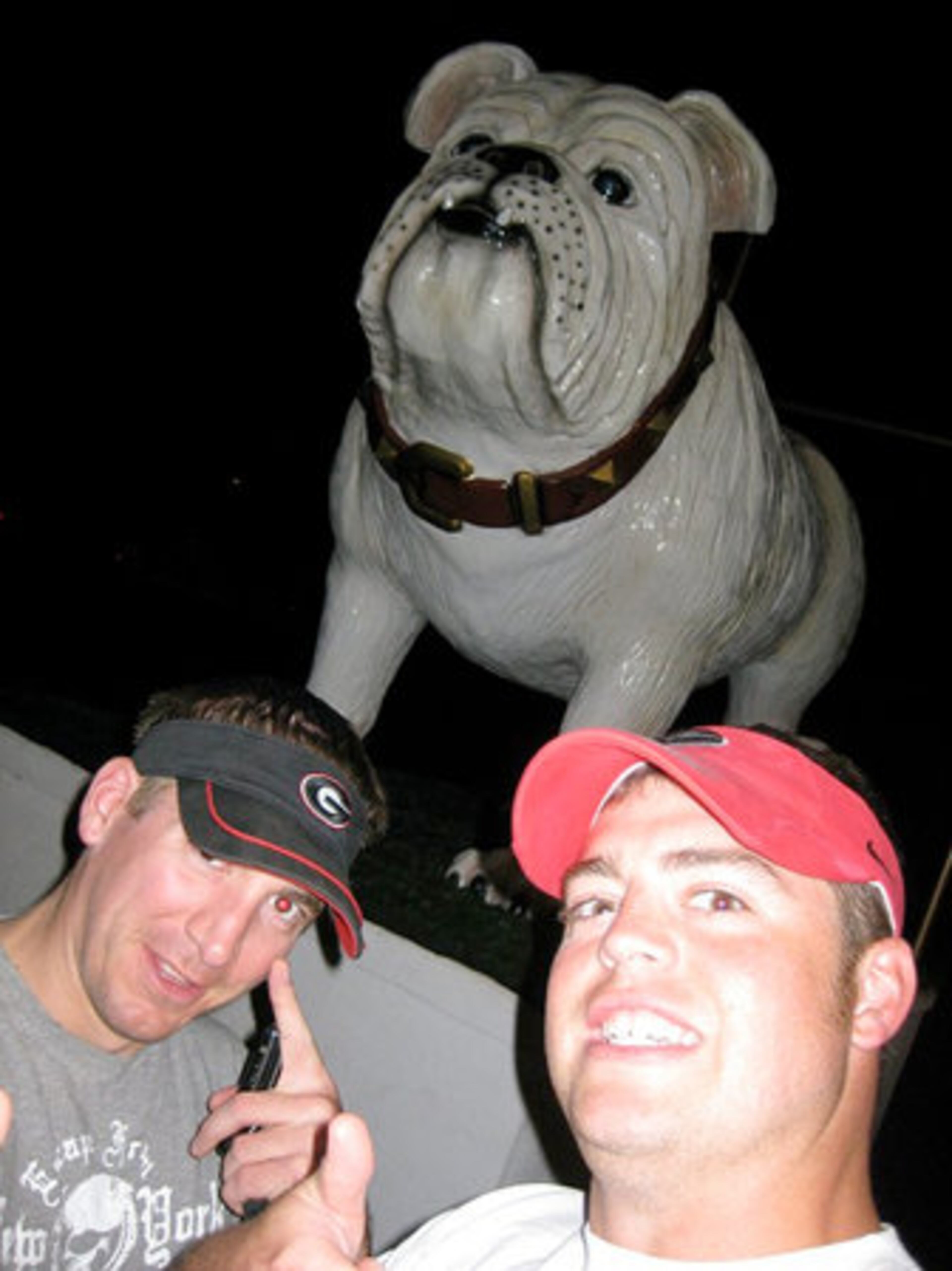 During a side trip before the Bullgogs take on the Sun Devils, Nate Baumgartner (left) and Matt Hunt (right) come across a giant bulldog in Winslow, AZ. The statue belongs to the Winslow High School Bulldogs.