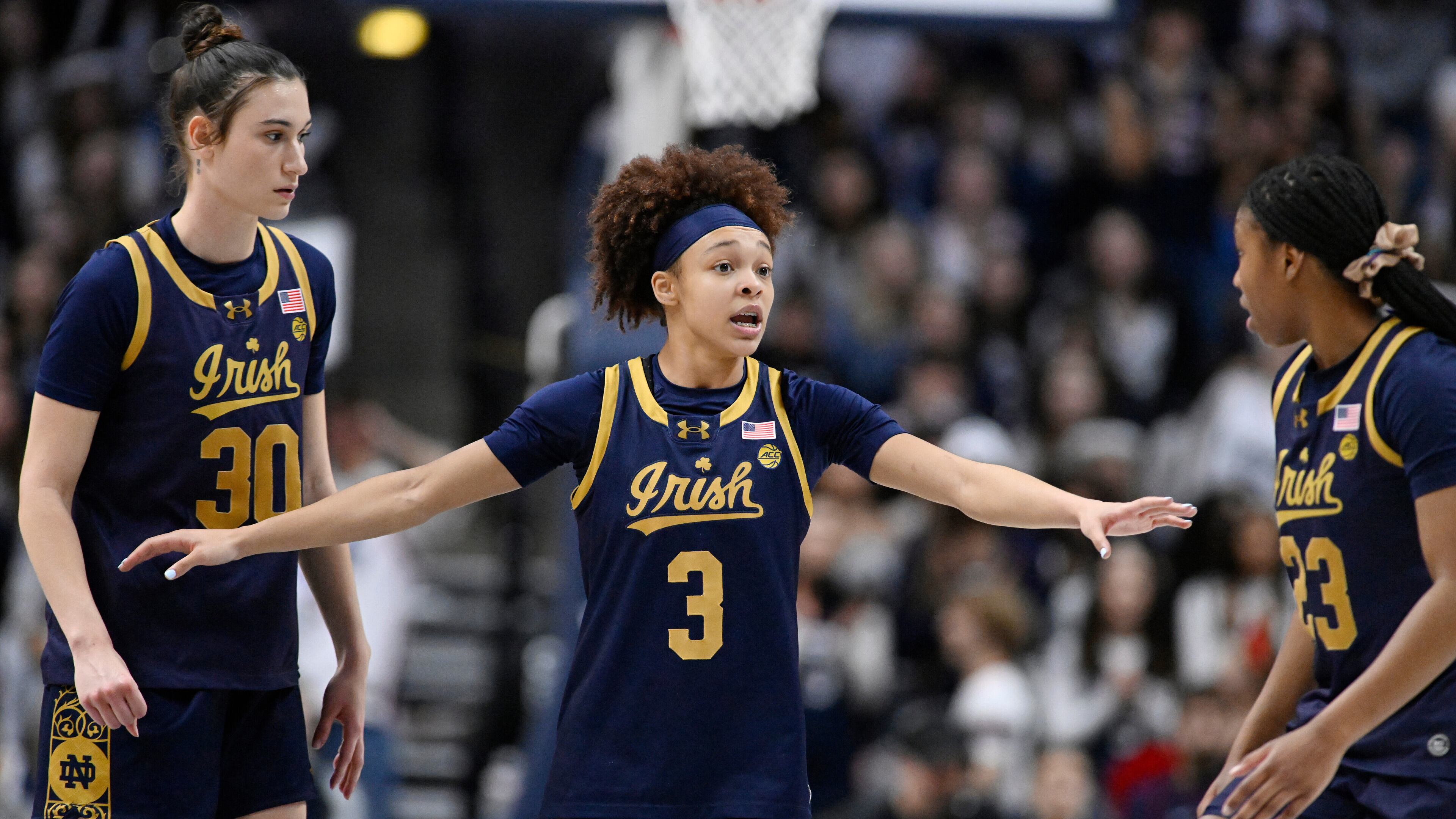 FILE - Notre Dame guard Hannah Hidalgo (3) talks with teammates Gisela Sanchez (30) and Iyana Moore (23) in the second half of an NCAA college basketball game against UConn, Monday, Jan. 19, 2026, in Storrs, Conn. (AP Photo/Jessica Hill)