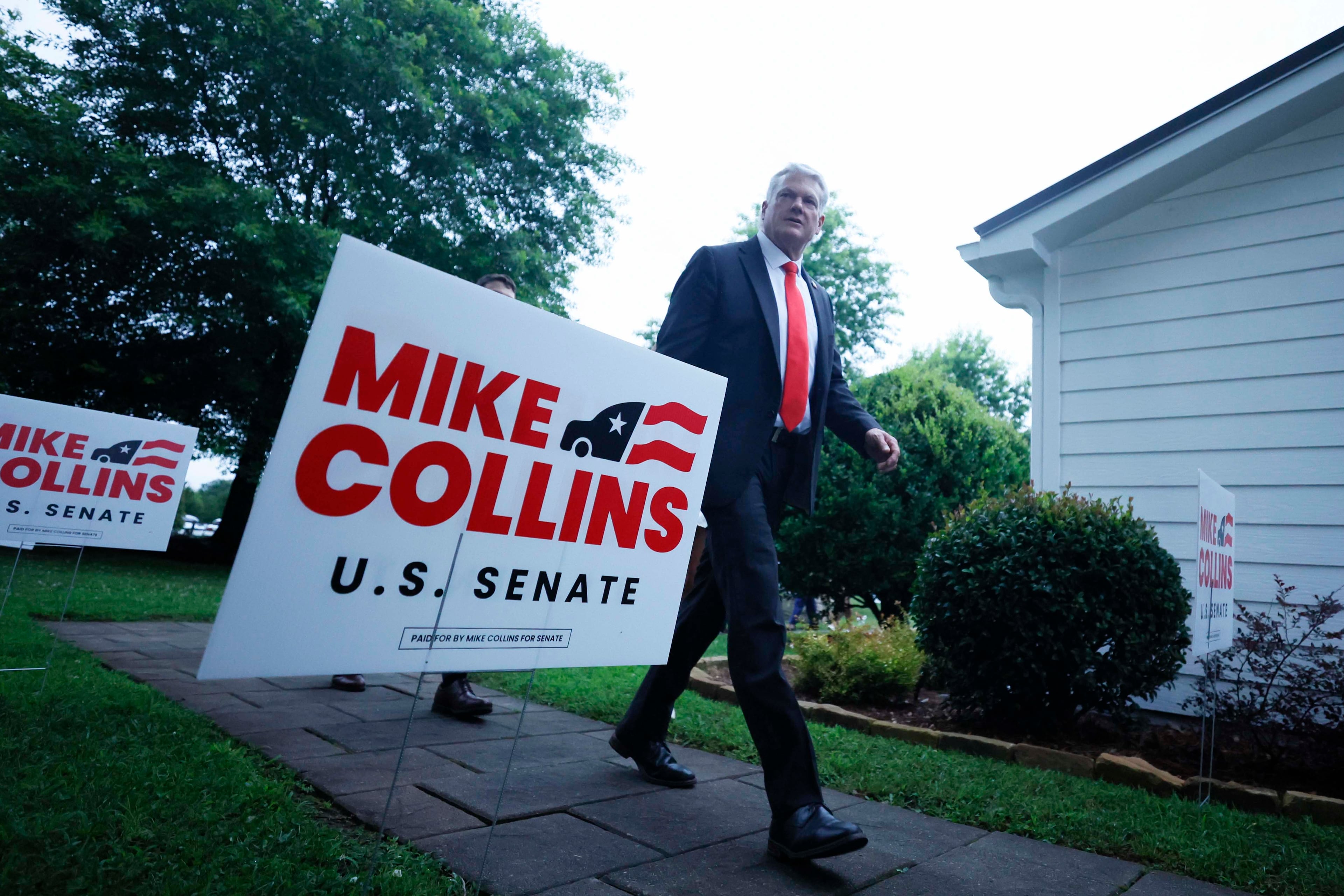 U.S. Rep. Mike Collins greets supporters during his June runoff election watch party in Jackson. (Miguel Martinez/AJC)