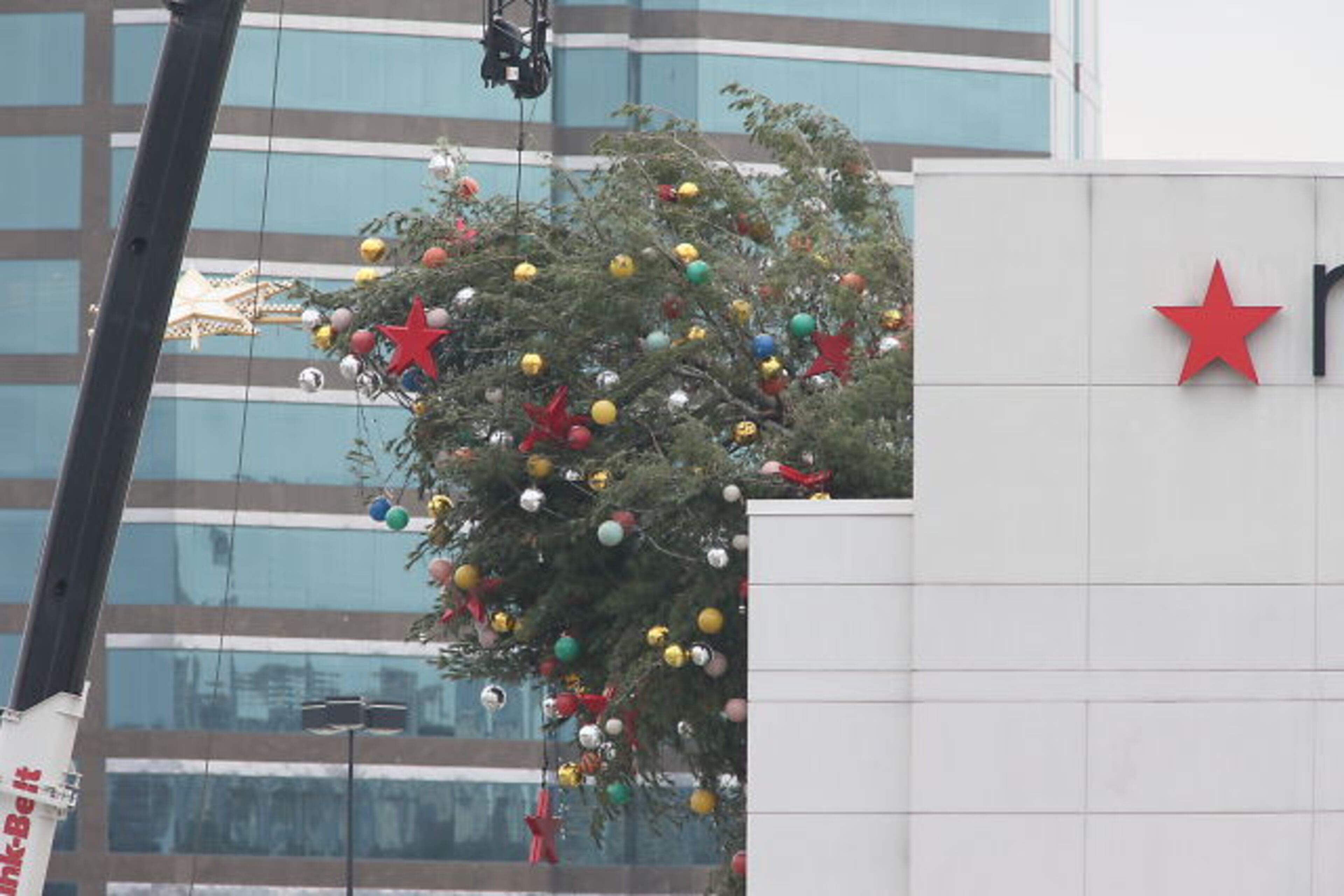 The tree is put atop Macy's each year. It was being lowered from the roof of the story on Wednesday when it fell.