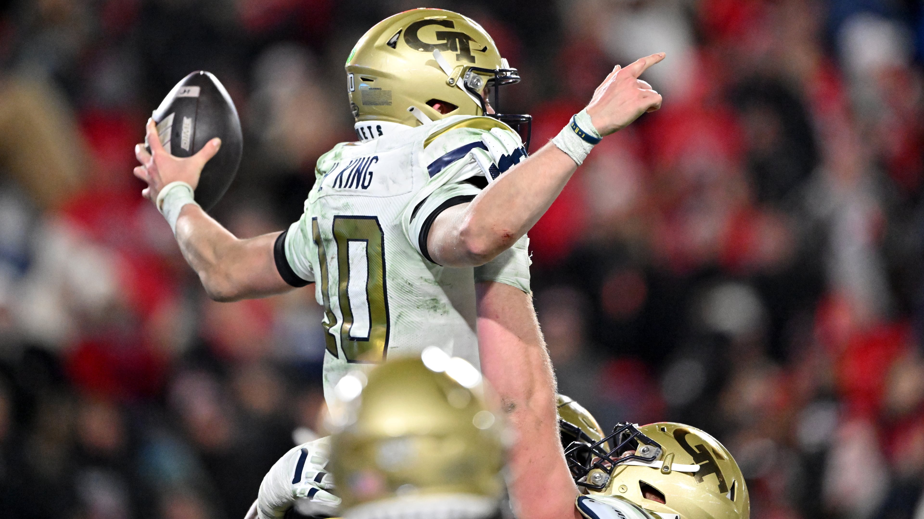 Georgia Tech quarterback Haynes King (10) celebrates after scoring a touchdown during the fourth quarter in an NCAA football game at Sanford Stadium, Friday, November 29, 2024, in Athens. Georgia won 44-42 in eight overtimes. (Hyosub Shin / AJC)