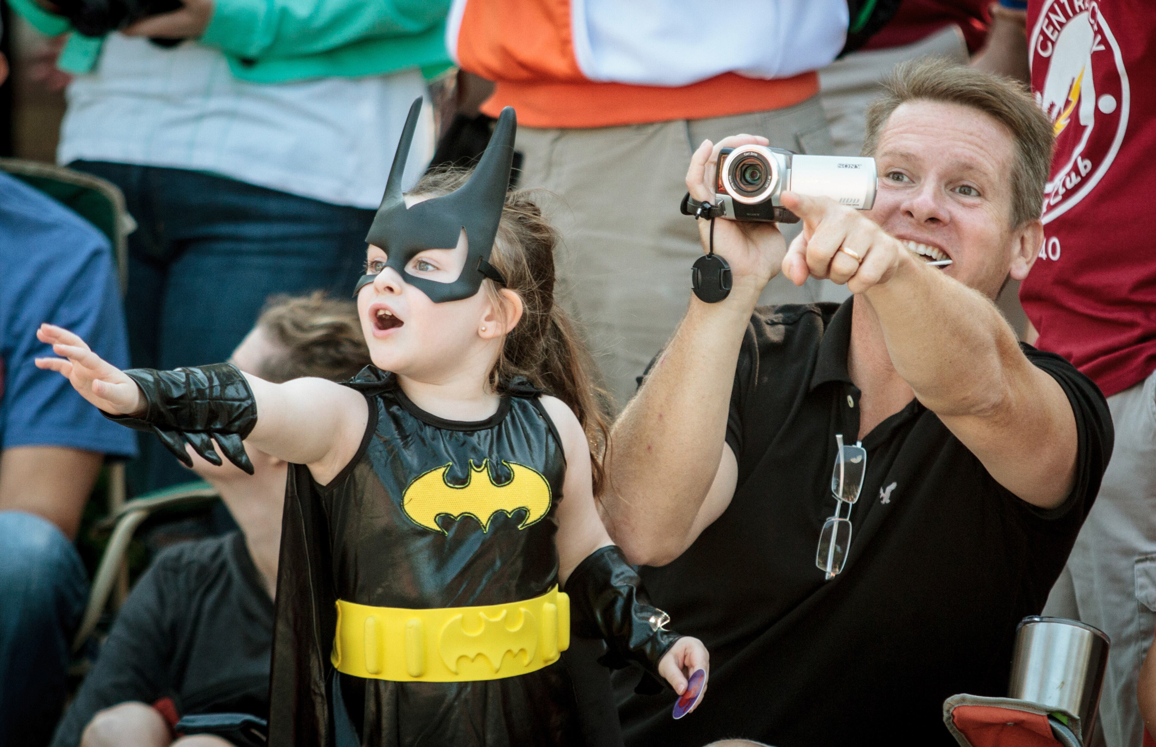Steve Prater and his daughter Adrianna wave to their favorite characters during the Dragon Con parade in Atlanta GA Saturday, September 2, 2017. STEVE SCHAEFER / SPECIAL TO THE AJC