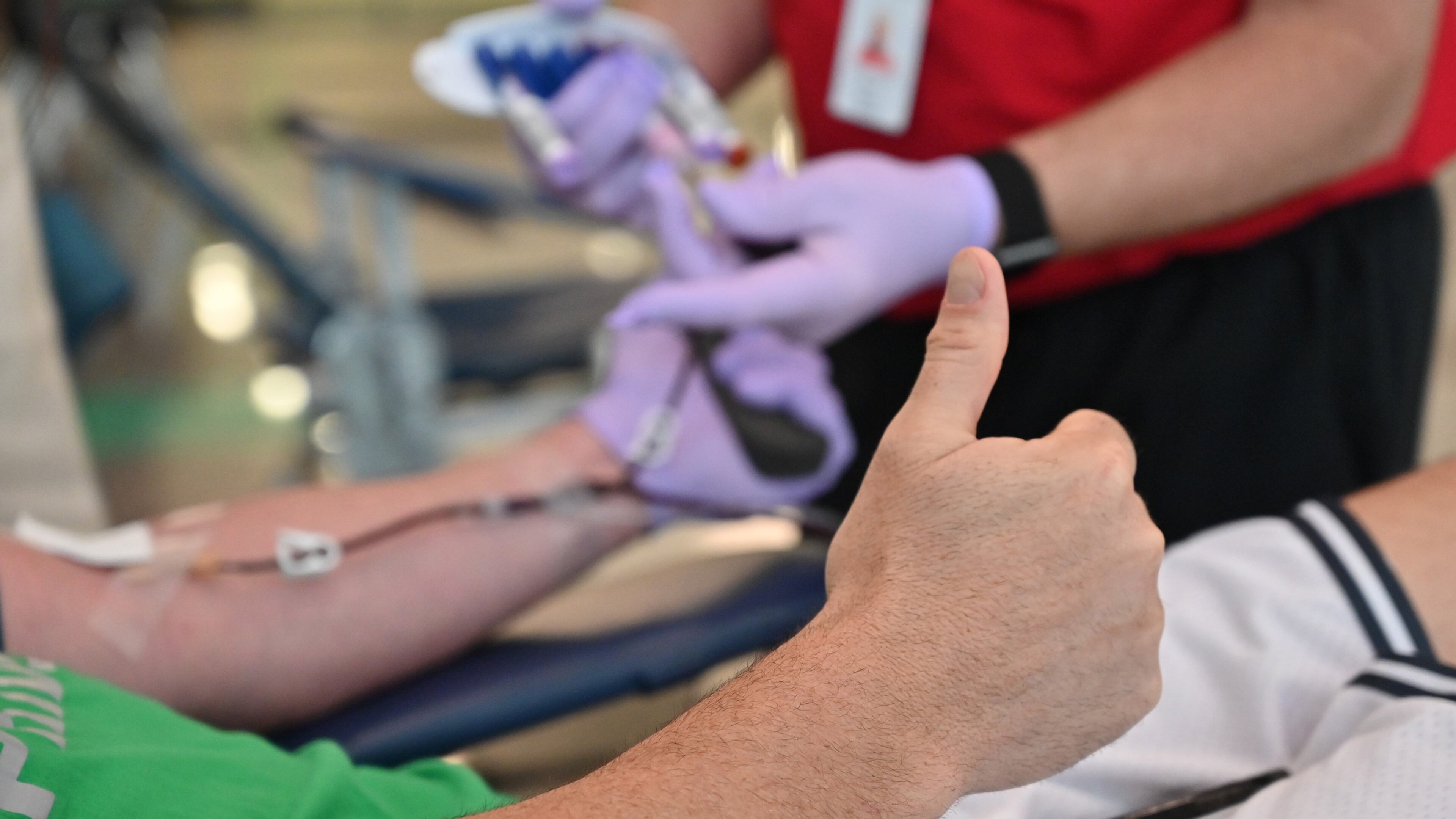 Brandon Hastings gives a thumbs-up as he donates blood during Buford City Schools’ annual Blood Drive at Buford Arena on Tuesday, March 31, 2020. With social distancing and extra measures to keep people safe from the coronavirus, blood supplies are getting dangerously low. (Hyosub Shin / Hyosub.Shin@ajc.com)