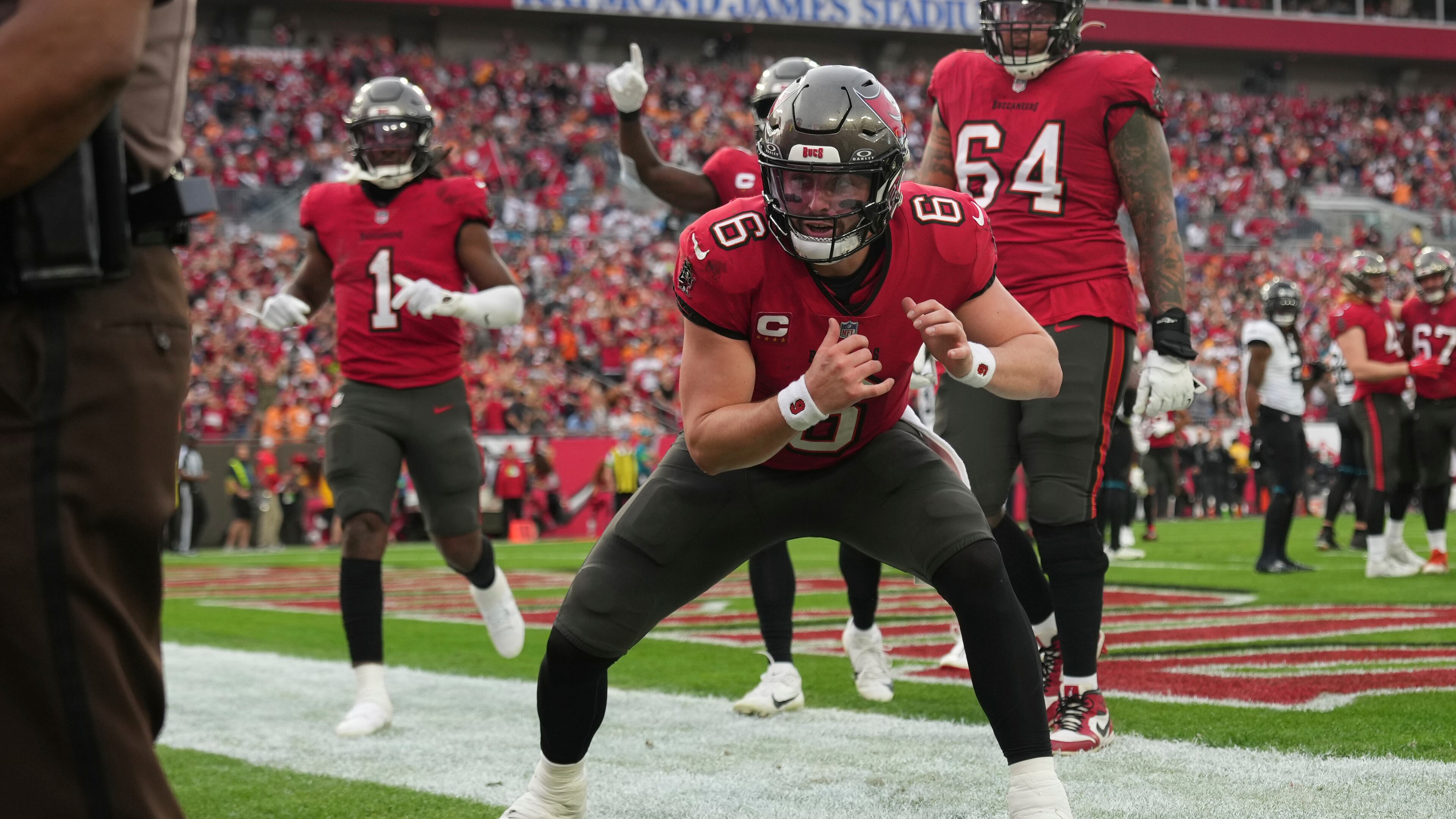 Tampa Bay Buccaneers quarterback Baker Mayfield (6) celebrates a touchdown I the first half during an NFL football game against the Jacksonville Jaguars, Sunday, Dec. 24, 2023, in Tampa, Fla. (AP Photo/Peter Joneleit)