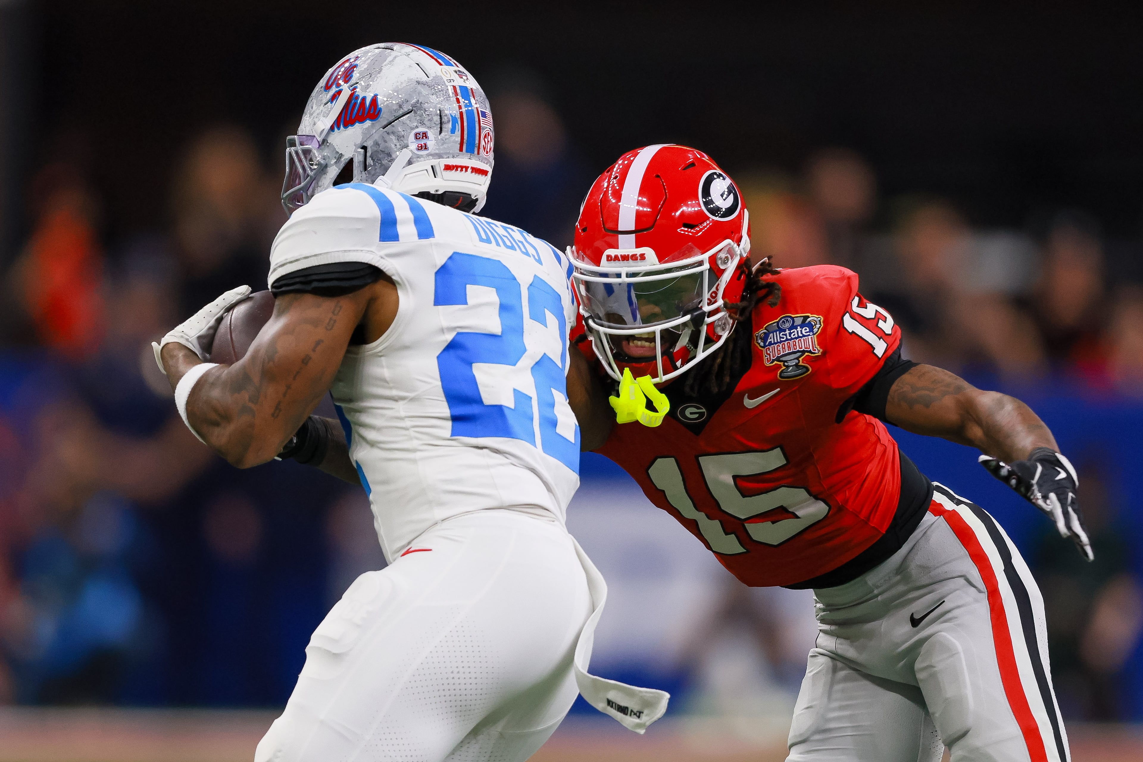 Georgia Bulldogs defensive back Demello Jones (15) stops Ole Miss Rebels running back Logan Diggs (22) during the first quarter of the NCAA College Football Playoff quarterfinal game at the Sugar Bowl in the Caesars Superdome, Thursday, Jan. 1, 2026, in New Orleans. (Jason Getz/AJC)