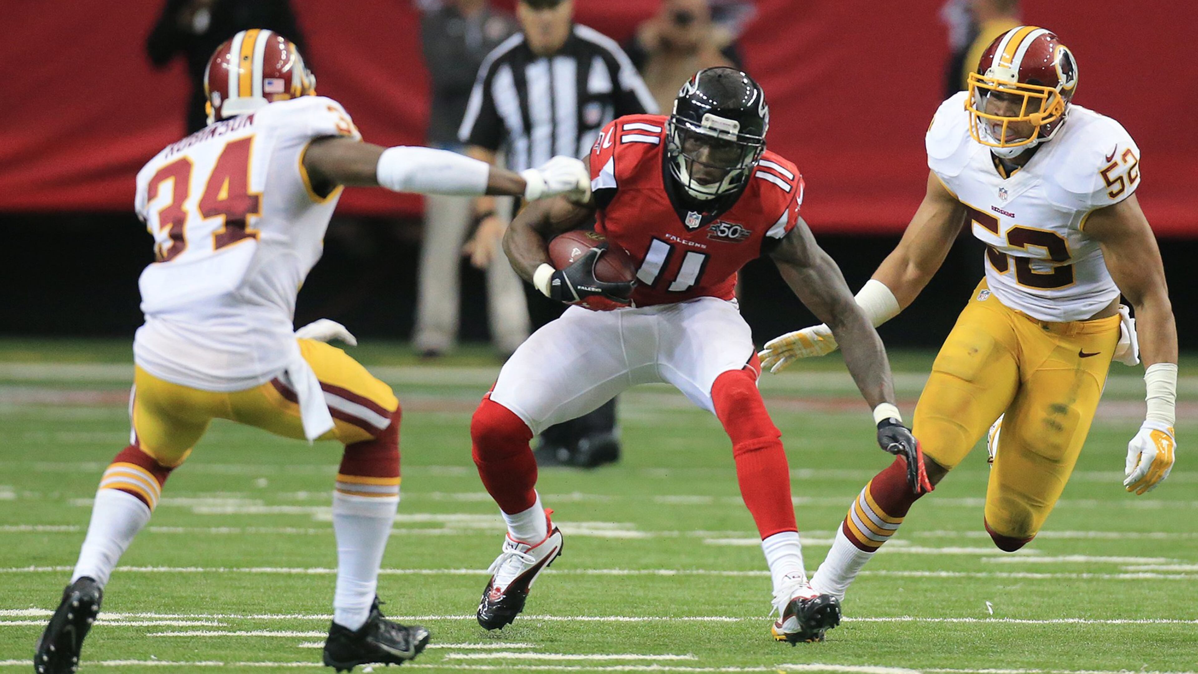 Falcons wide receiver Julio Jones makes a first down reception against the Redskins during the second half. (Curtis Compton / ccompton@ajc.com)
