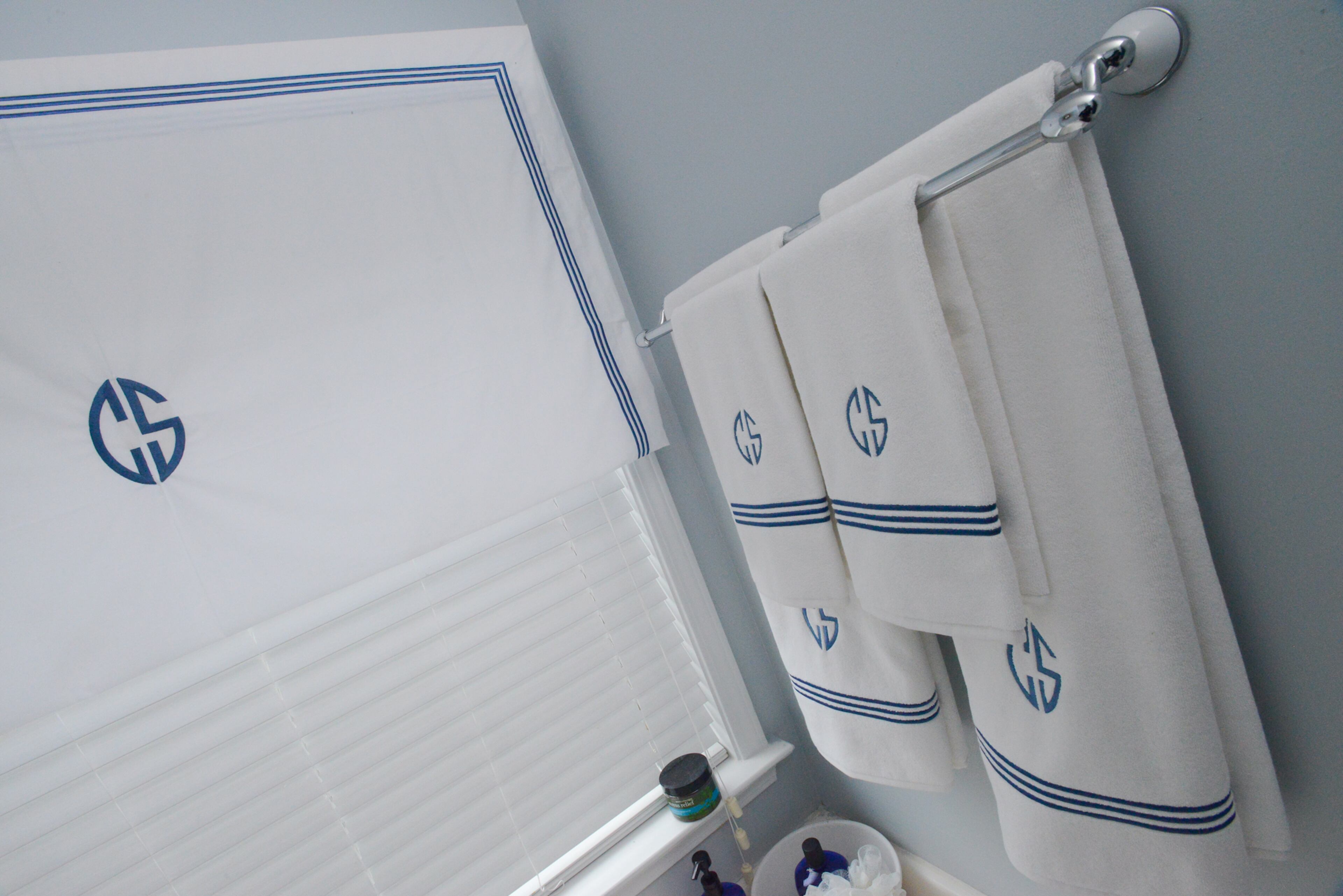 Monogrammed towels and valances in the master bathroom personalize the decor in the home.