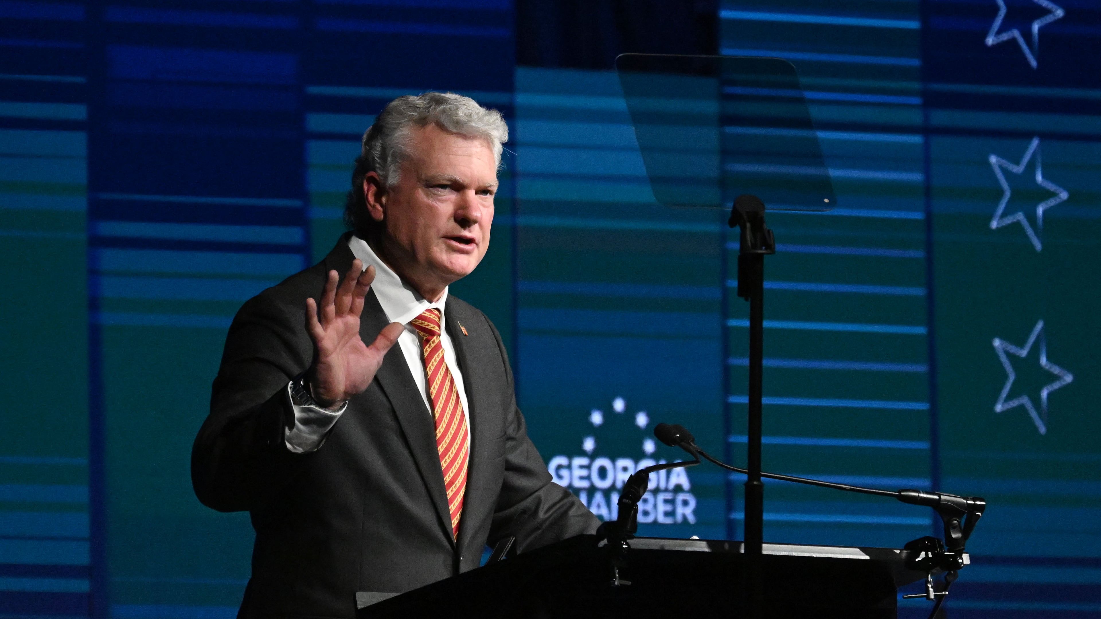 Republican U.S. Senate nominee Mike Collins speaks during the Georgia Chamber Congressional Luncheon at The Classic Center on Wednesday. Collins has sought to portray Democratic U.S. Sen. Jon Ossoff as a socialist, a charge Ossoff's camp dismissed as false. (Hyosub Shin/AJC)