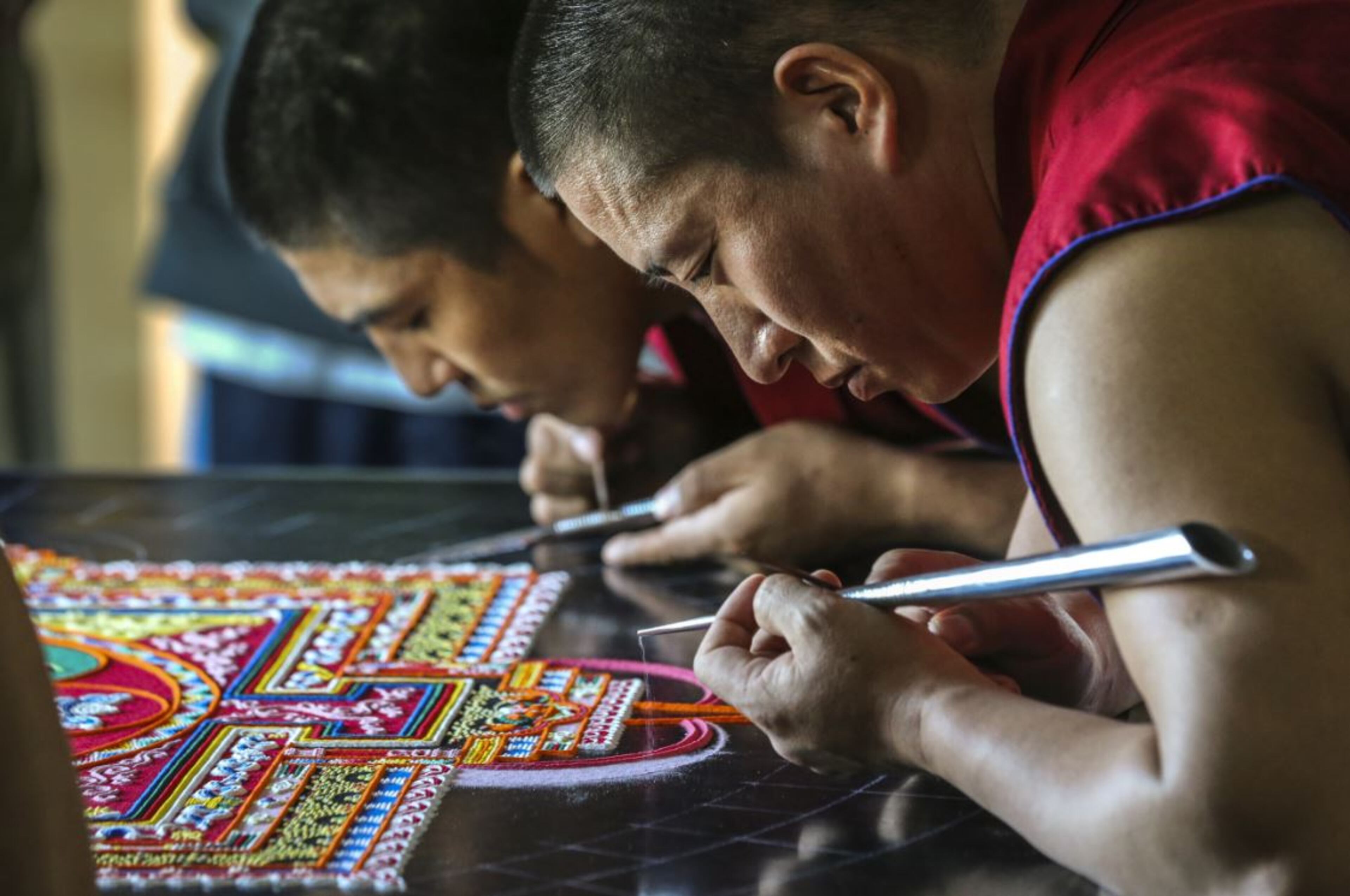 Tibetan monks, Lobsang Tsering (left) and Dorjee (right) continued Mandala Sand Painting on Thursday, March 23, 2017 at the Michael C. Carlos Museum as Emory University observes Tibet Week.