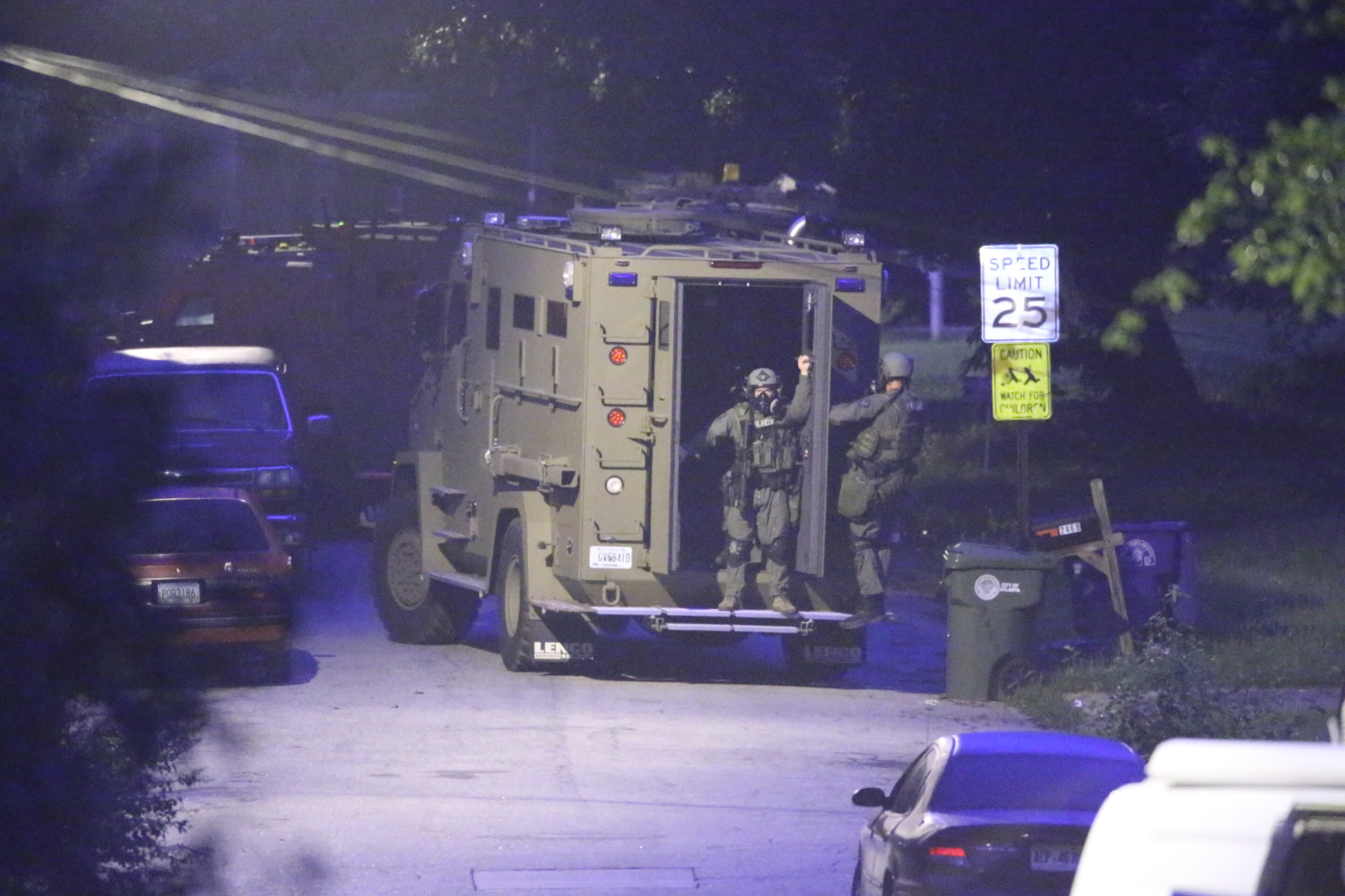 Atlanta police surrounded a home in southwest Atlanta for several hours early today, but when SWAT officers went into the house, the person whey were looking for was not there. JOHN SPINK/JOHNSPINK@AJC.COM