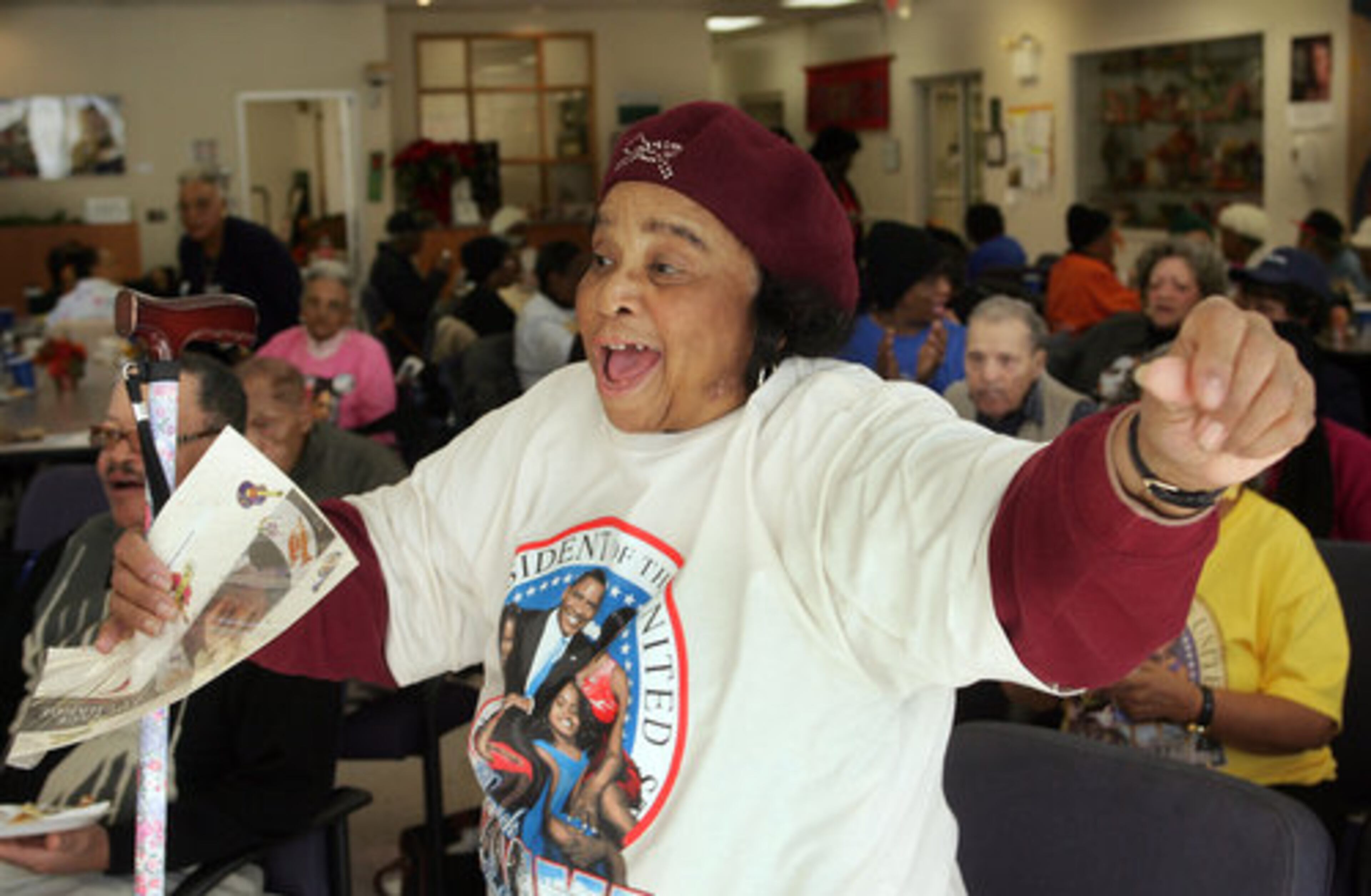 Helen Amos dances with joy after watching the historic inauguration of Barack Obama at the Dogwood Neighborhood Senior Center in Atlanta.