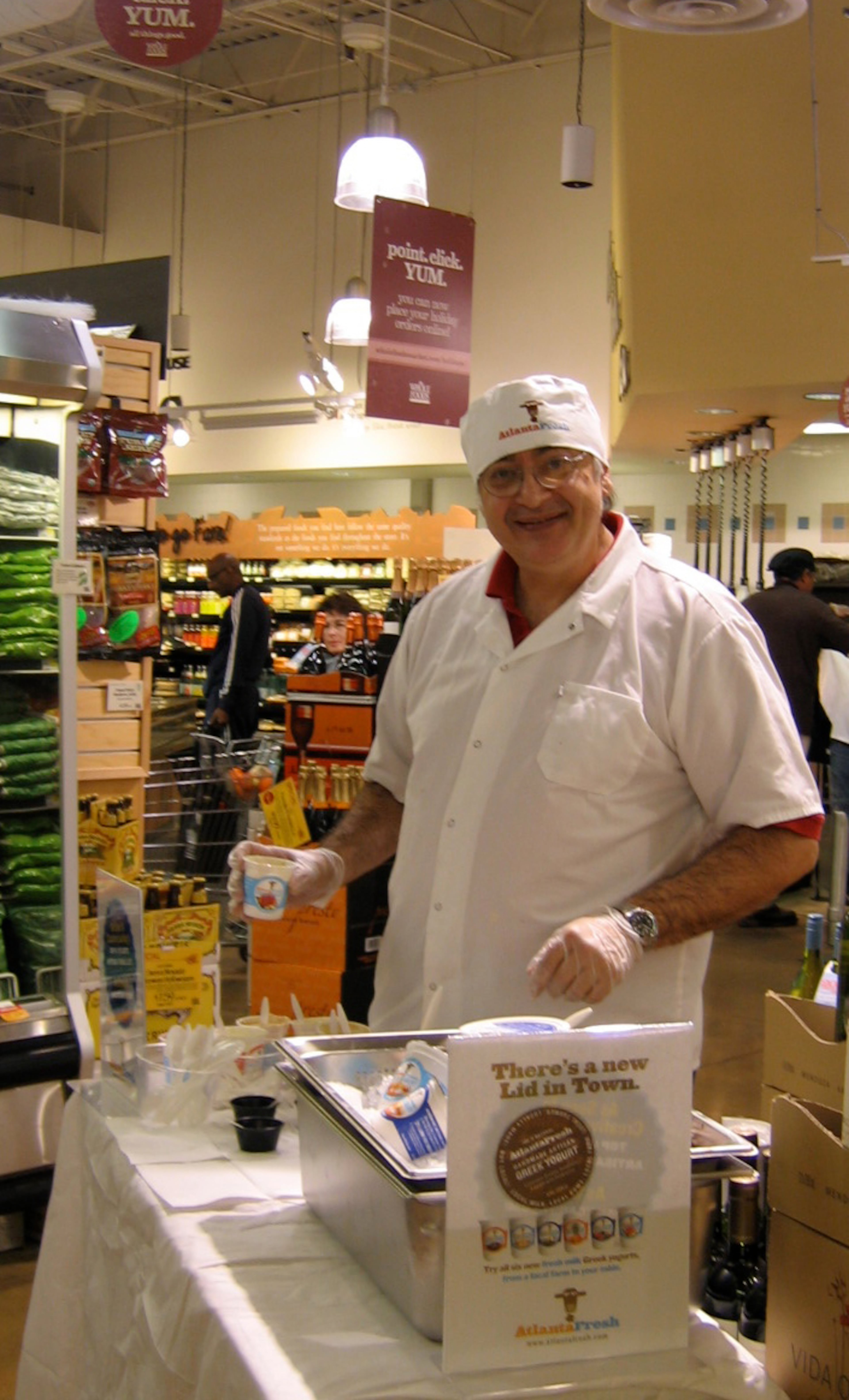 Getting out to talk to customers is one way Ron Marks gets ideas for new flavors for AtlantaFresh Artisan Creamery yogurts. Here, he is at the Briarcliff Road Whole Foods. Photo credit: AtlantaFresh Artisan Creamery
