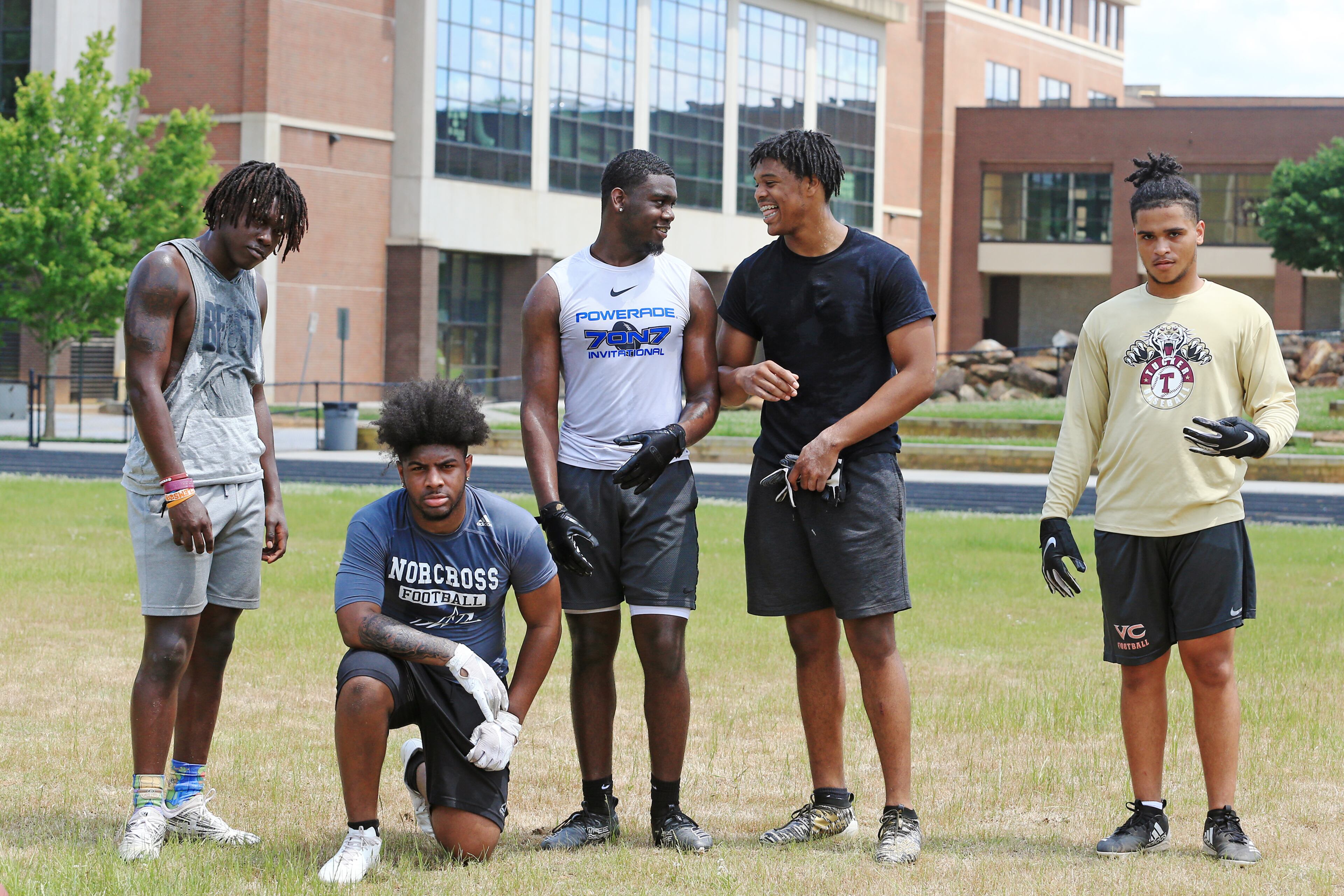 (Left to right) Keeman Hayes, Randy Britt, Travis Davis, Camren Jackson and Kaece Supples pose for a photo after an unsanctioned player-led football practice on Thursday, June 4, 2020, at Tucker High School in Tucker, Georgia. The players planned the off-season practice despite uncertainty surrounding the upcoming football season amid coronavirus concerns. CHRISTINA MATACOTTA FOR THE ATLANTA JOURNAL-CONSTITUTION