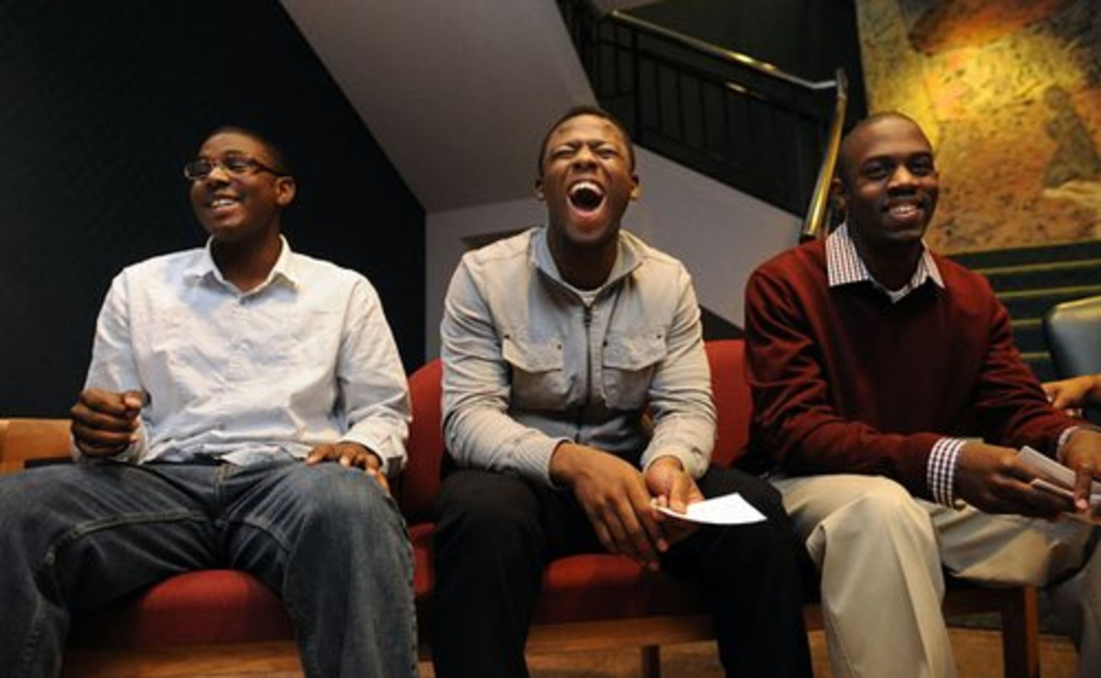 (From left) Jarel Billups, 18, Dante Artis, 18, and Kelton Buchanan, 17, react during their practice for the annual scholarship breakfast.