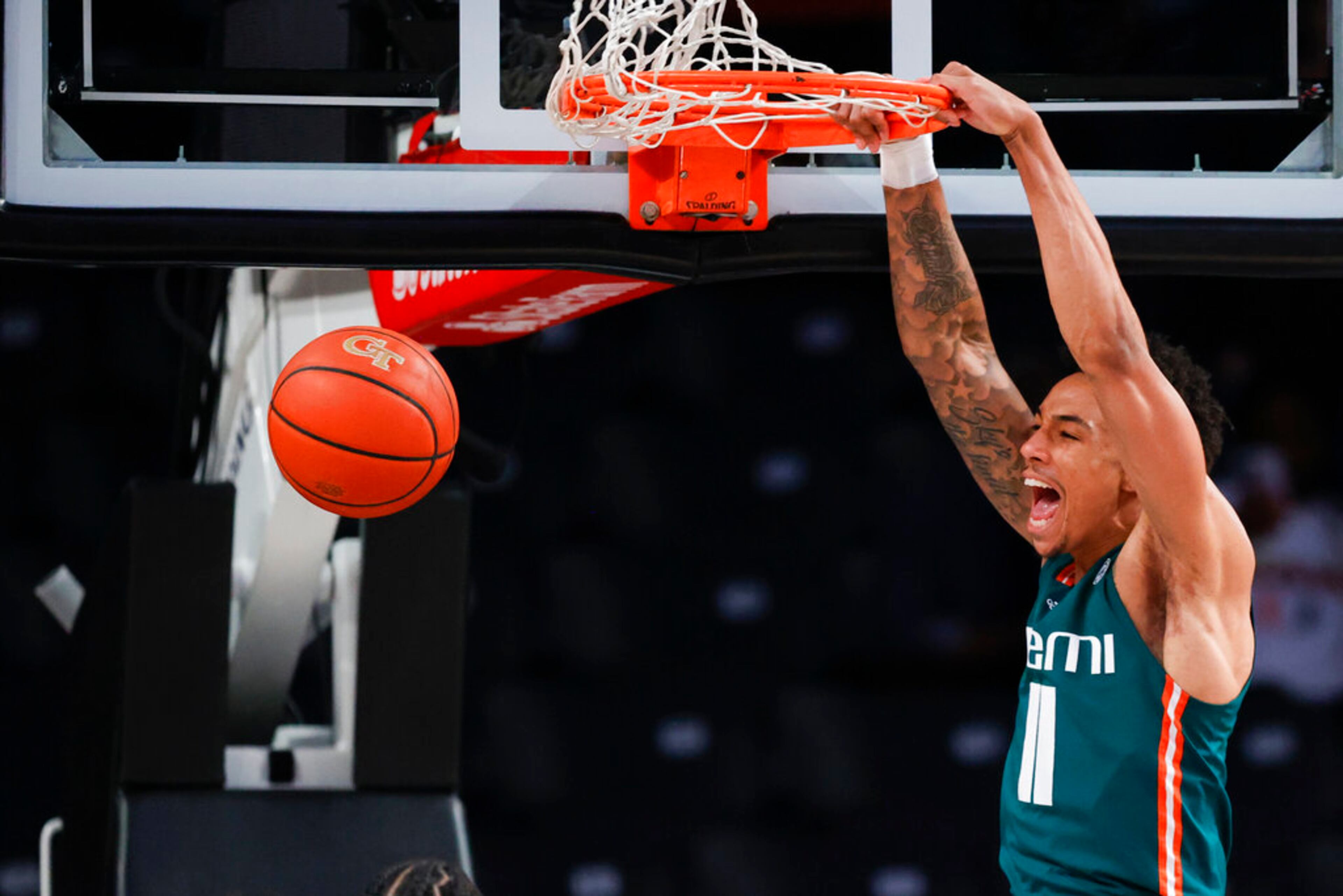 Miami guard Jordan Miller dunks against Georgia Tech during the first half of an NCAA college basketball game Wednesday, Jan. 4, 2023, in Atlanta. (AP Photo/Alex Slitz)