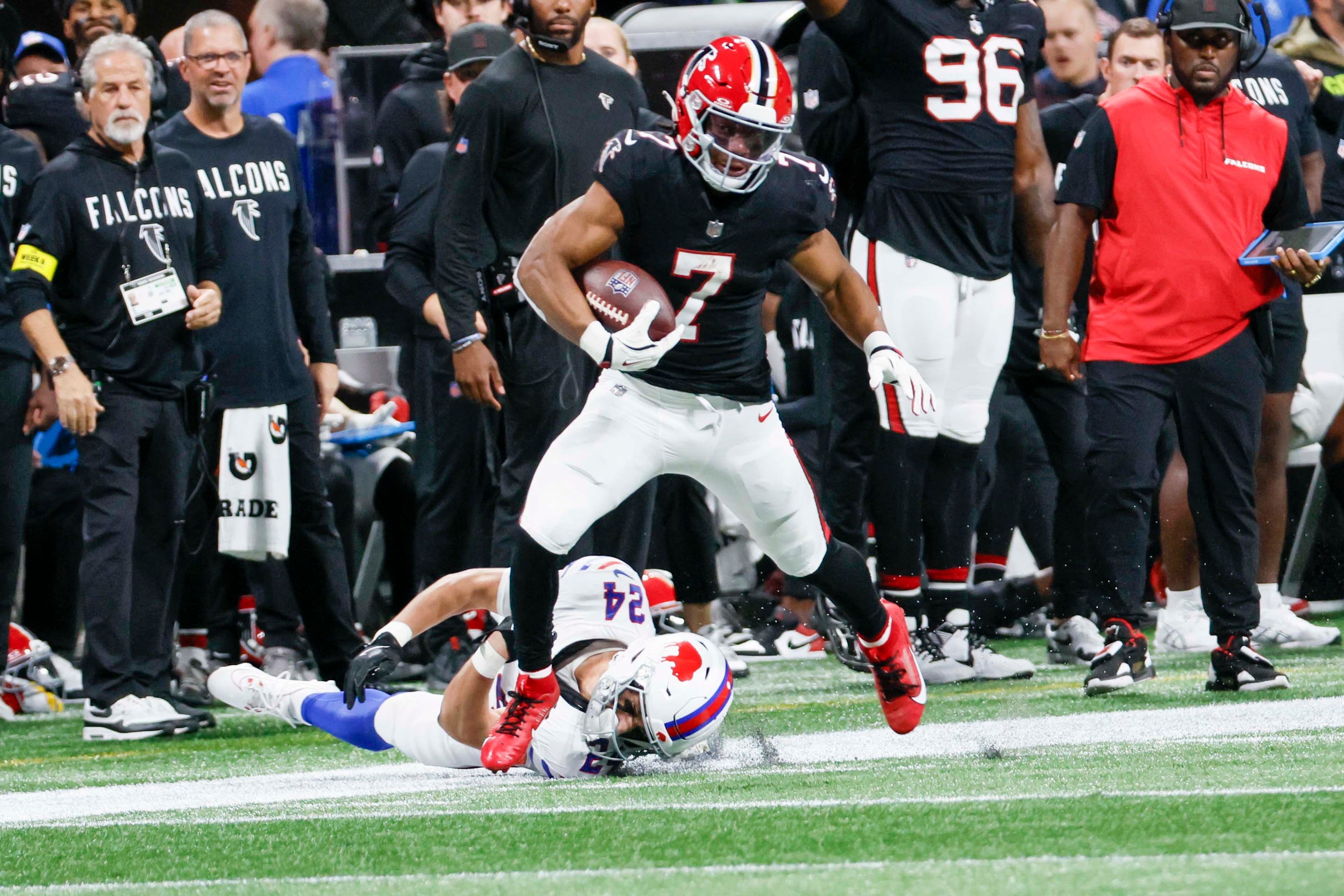 Atlanta Falcons running back Bijan Robinson avoids a tackle to run for his touchdown during the first half of an NFL football game against the Buffalo Bills at Mercedes-Benz Stadium in Atlanta on Monday, October 13, 2025. (Miguel Martinez/AJC)