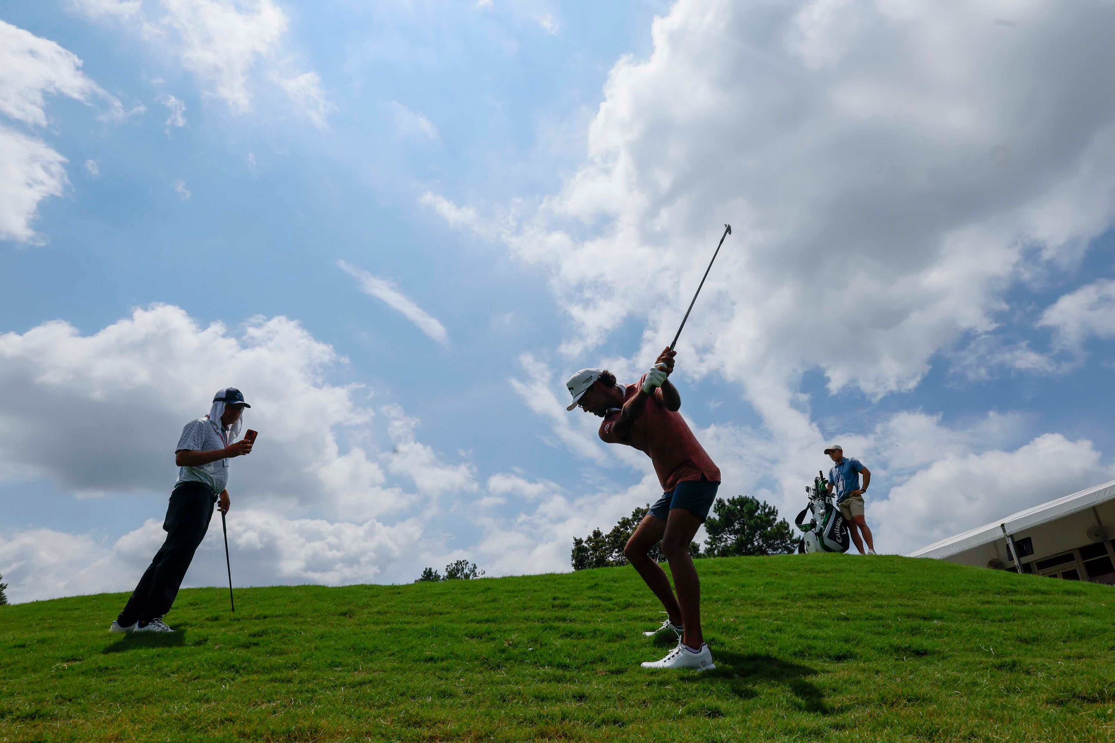 Akshay Bhatia chips the ball on the 17th hole during the practice round of the Tour Championship on Wednesday, Aug. 20, 2025, at East Lake Golf Club in Atlanta. (Miguel Martinez/AJC)