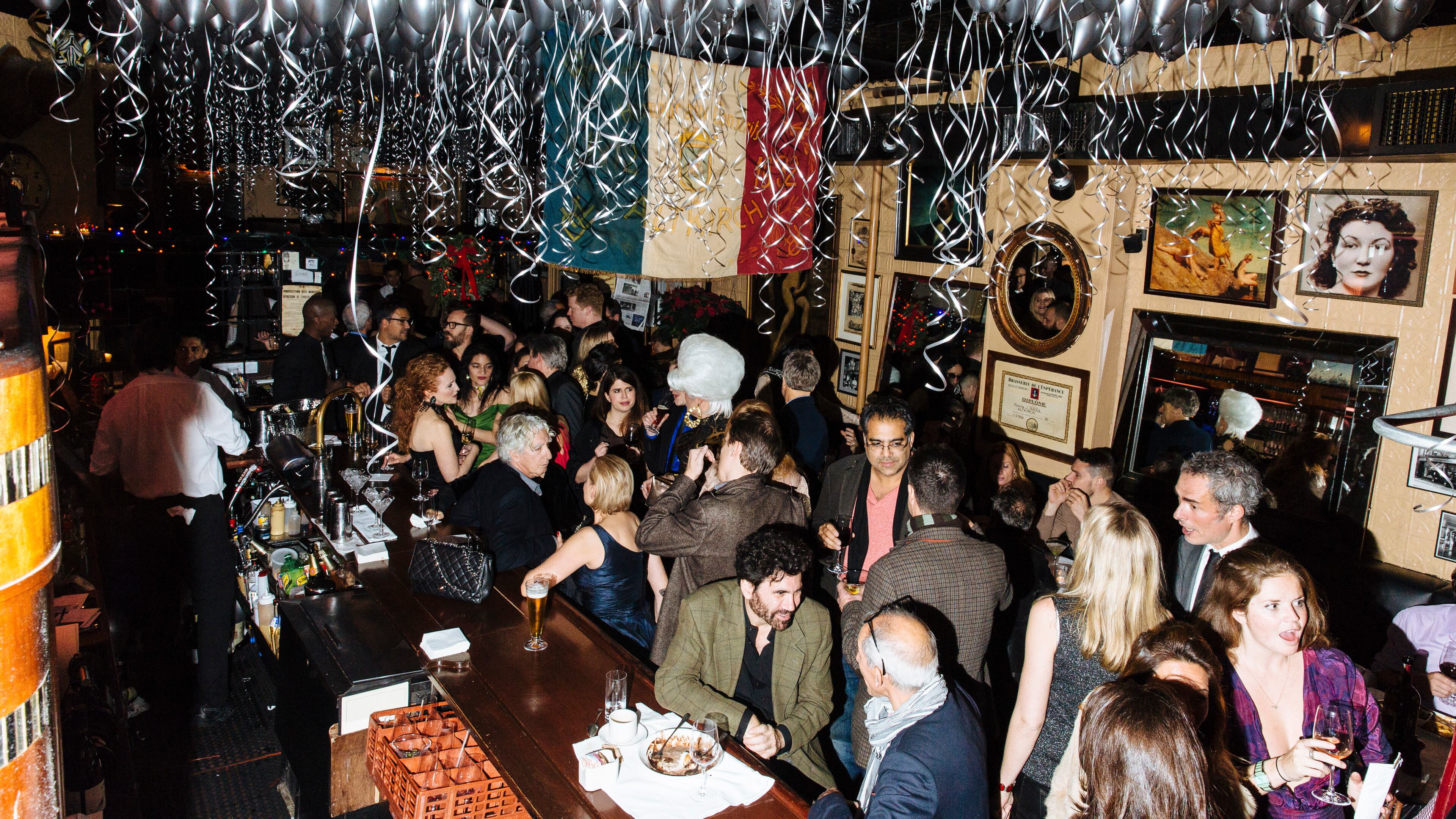 The bar scene at Raoul’s during it's 40th anniversary party in the in New York, Dec. 8, 2015. Opened in 1975, the low-key French bistro on Prince Street continues to be a refuge for SoHo’s bohemian old guard and younger scene makers.