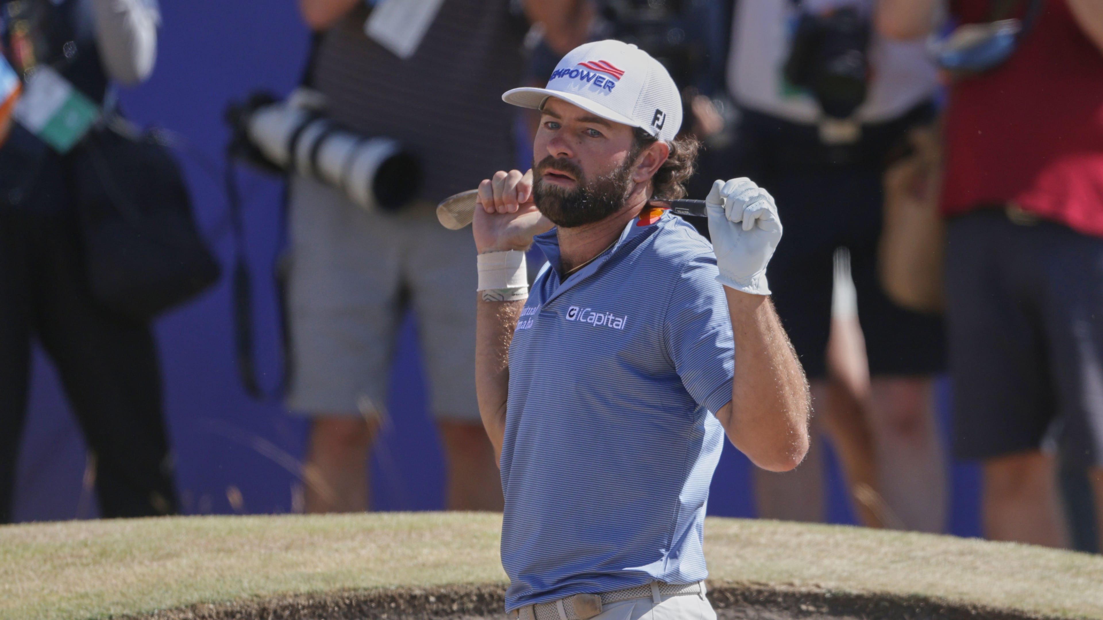 Cameron Young of the United States reacts after playing out of a bunker on the 18th green during the final day of the British Open Golf championships at Royal Birkdale golf club, in Southport, England, Sunday, July 19, 2026. (AP Photo/Peter Morrison)