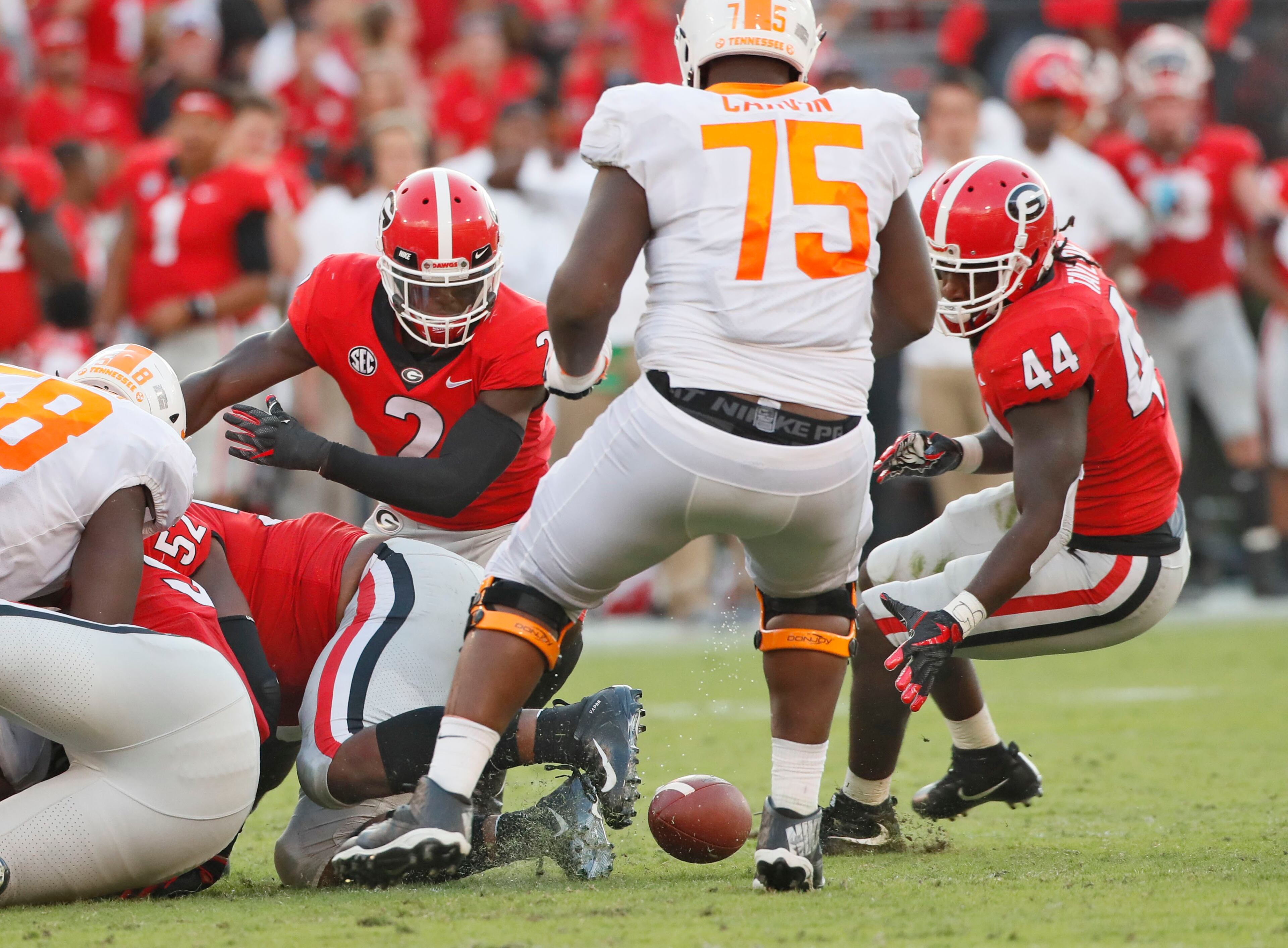Georgia Bulldogs defensive back Richard LeCounte (2) and Georgia Bulldogs linebacker Juwan Taylor (44) pursue a fumble by Tennessee Volunteers running back Jeremy Banks (33) that was recovered by Taylor in the second half. The University of Georgia Bulldogs played the Tennessee Volunteers in a NCAA college football game Saturday, Sept 29, 2018, at Sanford Stadium in Athens, GA. BOB ANDRES /BANDRES@AJC.COM