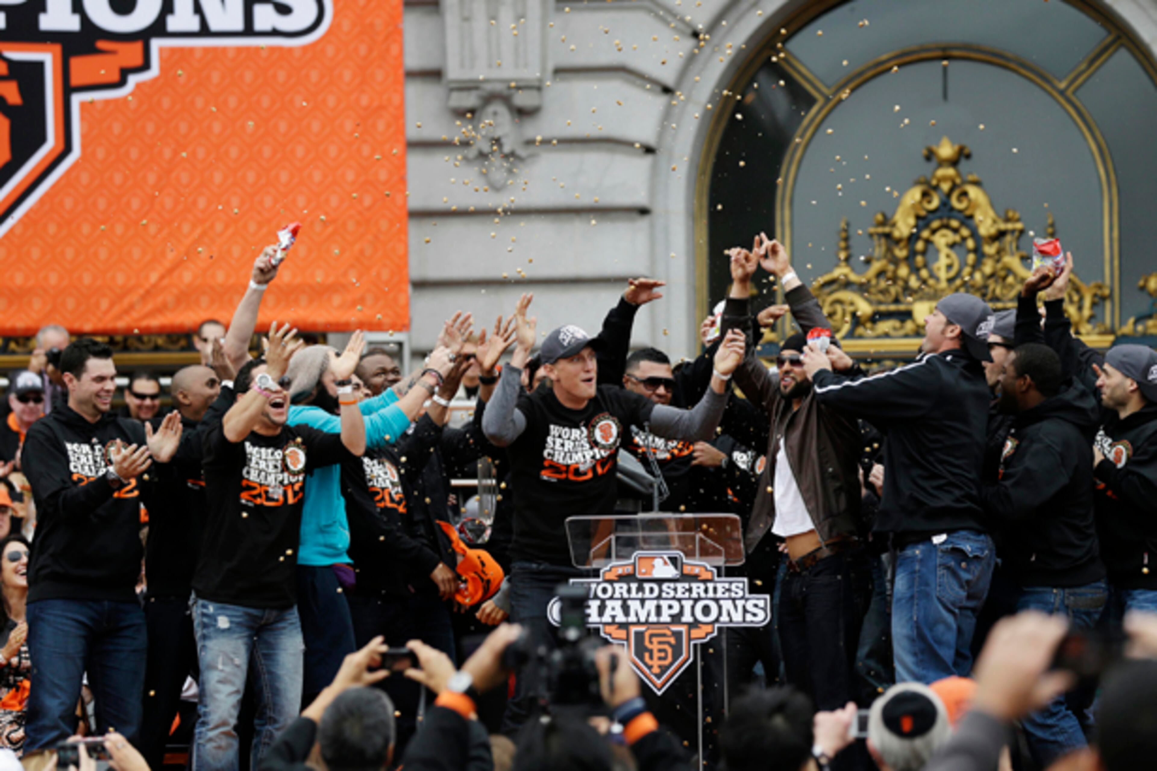 San Francisco Giants right fielder Hunter Pence, at podium, leads the team in a cheer during the baseball team's World Series victory celebration at City Hall, Wednesday, Oct. 31, 2012, in San Francisco. The team's second championship in three years included a parade along Market Street and ended with a celebration in front of City Hall. (AP Photo/Marcio J. Sanchez)