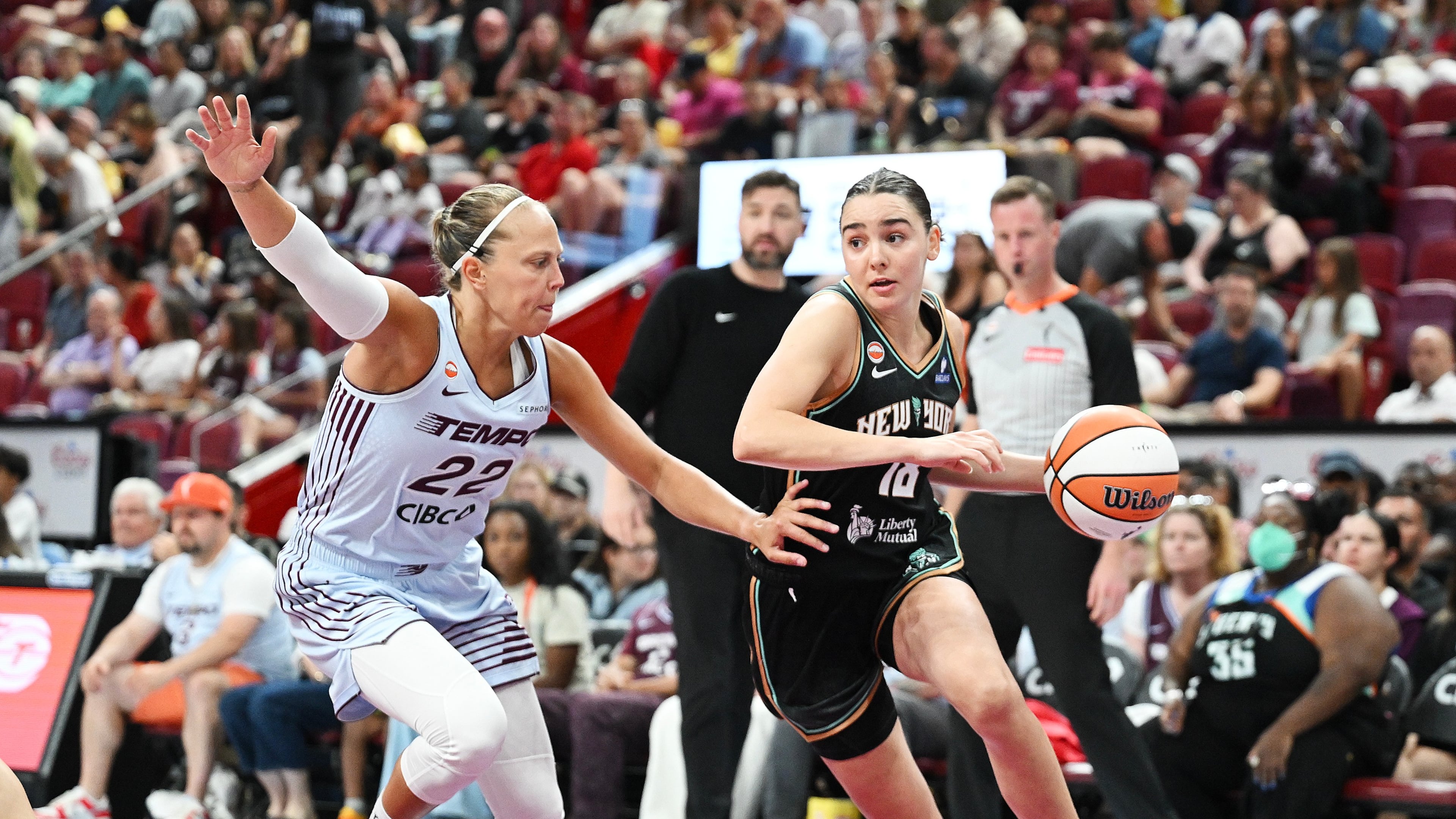 Toronto Tempo's Julie Allemand (22) defends against New York Liberty's Pauline Astier (18) during the second half of a WNBA basketball game in Montreal, on Sunday, July 12, 2026. (Graham Hughes/The Canadian Press via AP)