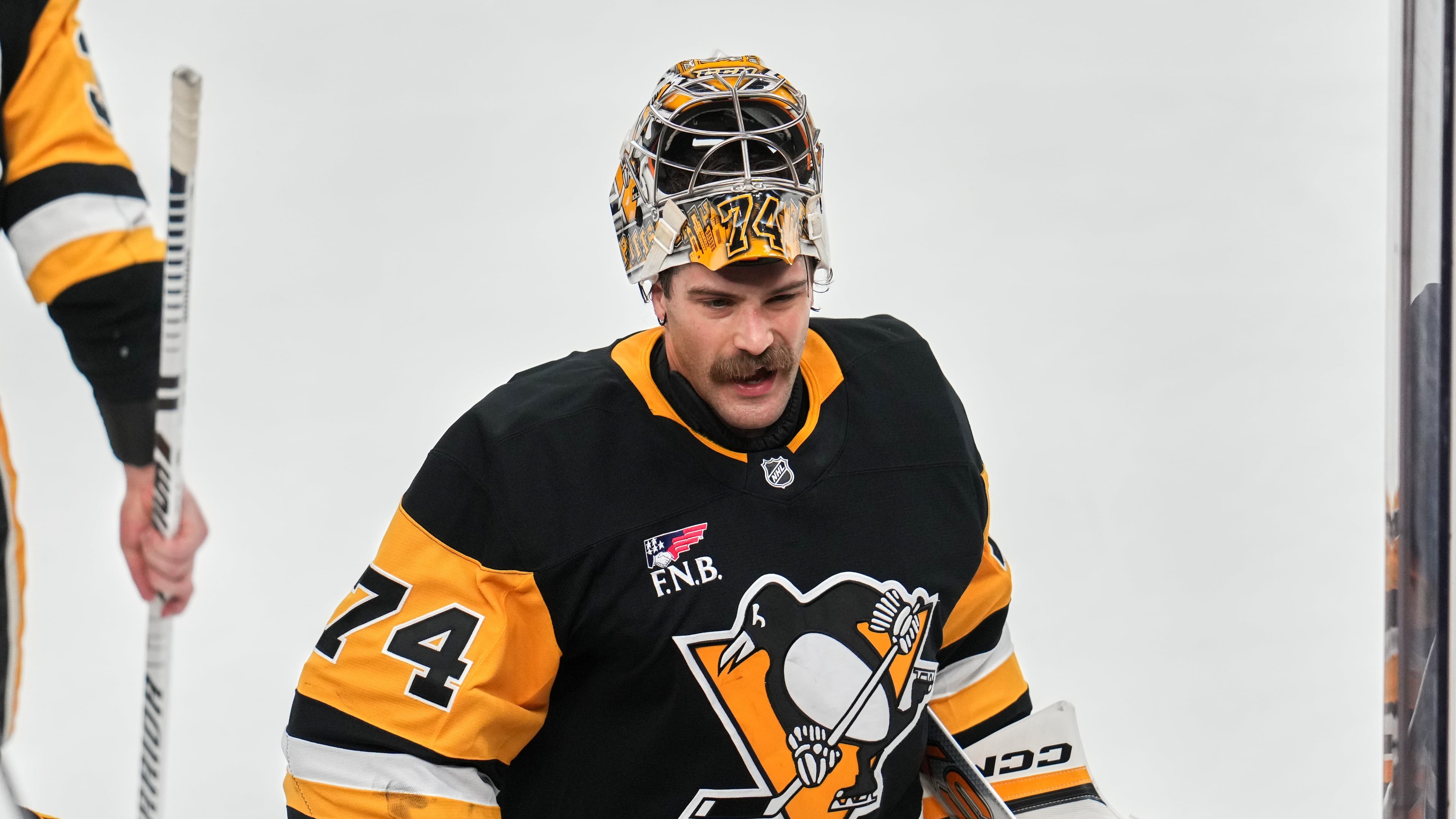 FILE - Pittsburgh Penguins goaltender Stuart Skinner takes a timeout during the first period of an NHL hockey game against the Dallas Stars in Pittsburgh, March 28, 2026. (AP Photo/Gene J. Puskar, File)