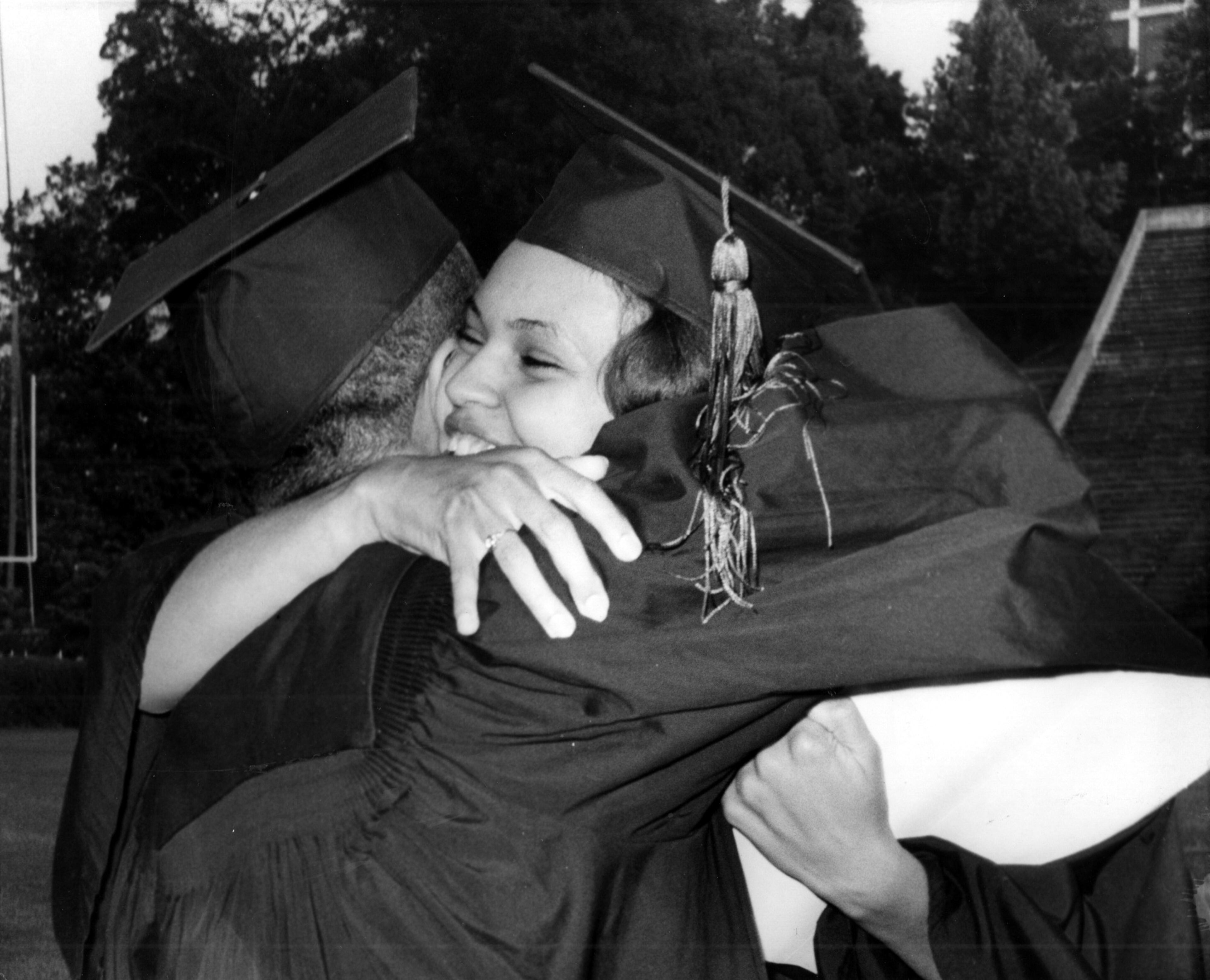 Hamilton Holmes and Charlayne Hunter hug each other after diplomas were awarded during the University of Georgia's 160th commencement in Athens on June 2, 1963. AP