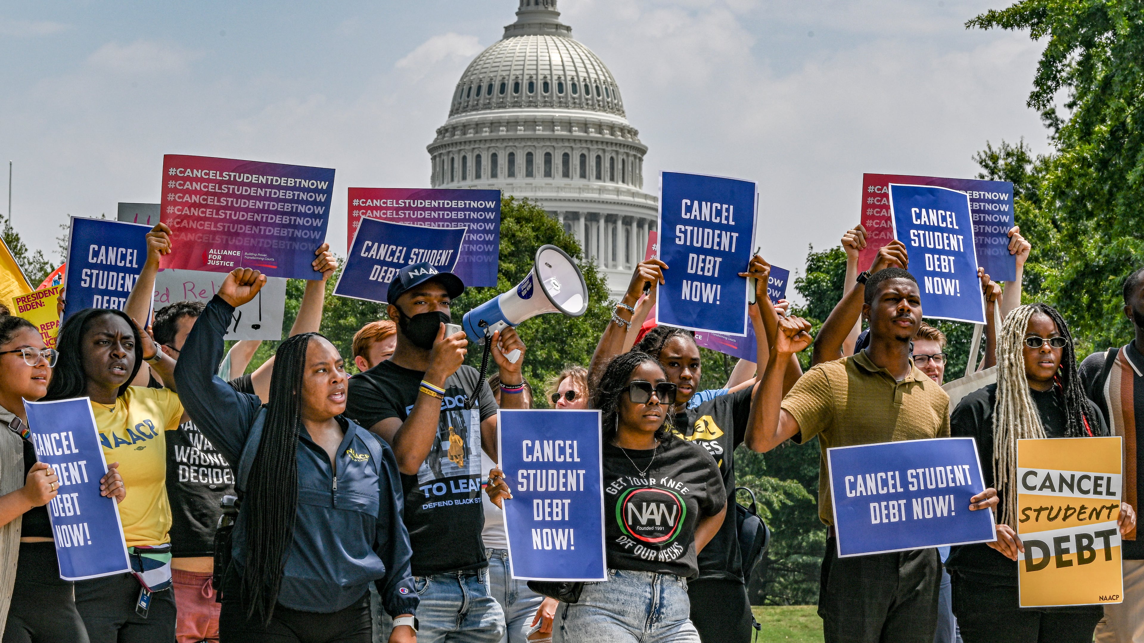 Demonstrators calling for the cancellation of student debt, in Washington, June 30, 2023. The Biden administration’s new income-driven repayment plan, SAVE, will reduce payments for millions of borrowers and more will qualify for $0 payments. (Kenny Holston/The New York Times)