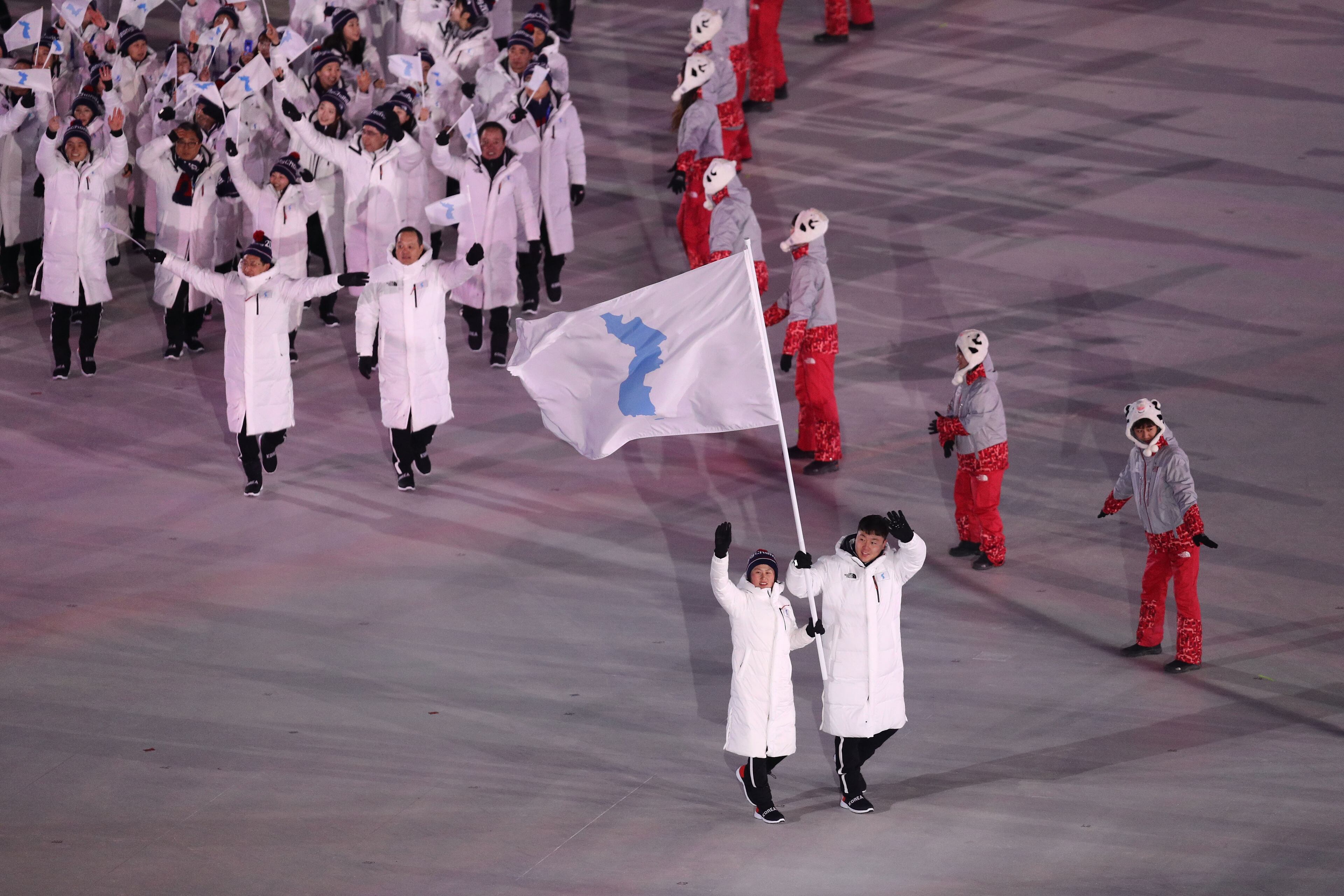 PYEONGCHANG-GUN, SOUTH KOREA - FEBRUARY 09: Flag bearers Chung Guam Hwang and Yunjong Won of Republic of Korea leads the team during the Opening Ceremony of the PyeongChang 2018 Winter Olympic Games at PyeongChang Olympic Stadium on February 9, 2018 in Pyeongchang-gun, South Korea. (Photo by Maddie Meyer/Getty Images)