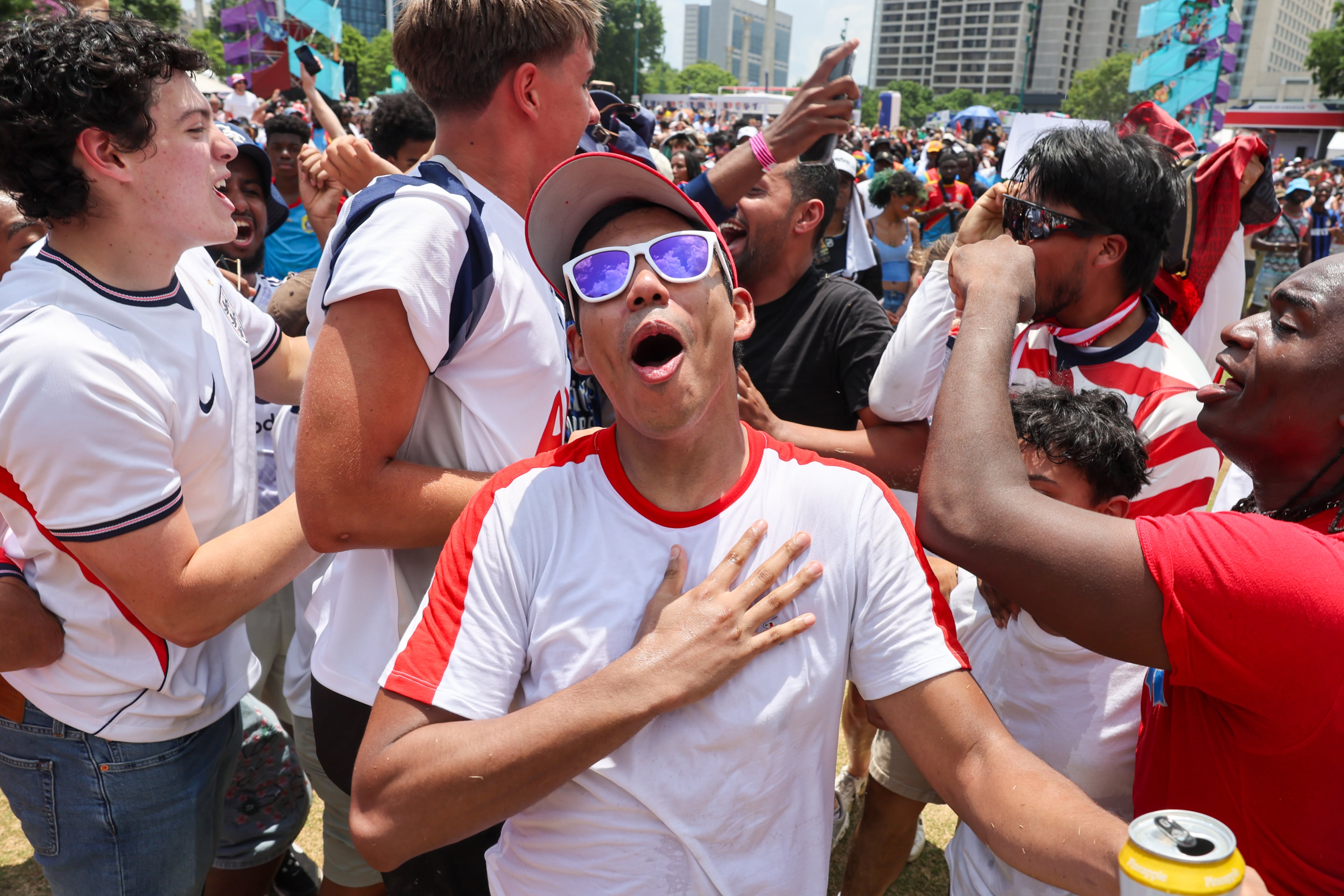 England fans react to their second goal at Fan Fest in Centennial Olympic Park in Atlanta in the second half of the England versus Congo FIFA World Cup game on July 1, 2026. The game was played in Atlanta Stadium (Mercedes Benz Stadium) for the knockout round of 32. England won 2-1. (Arvin Temkar/AJC)