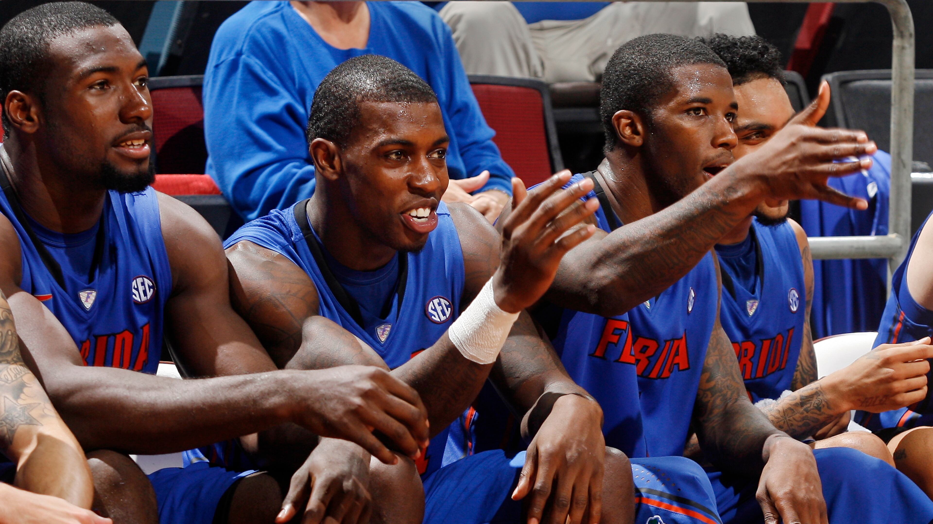 Florida's Patric Young (4), Casey Prather (24) and Kenny Boynton (1) gesture the Tomahawk Chop at the end of an NCAA college basketball game against Florida State, Wednesday, Dec. 5, 2012, in Tallahassee, Fla. Florida won 72-47. (AP Photo/Phil Sears)