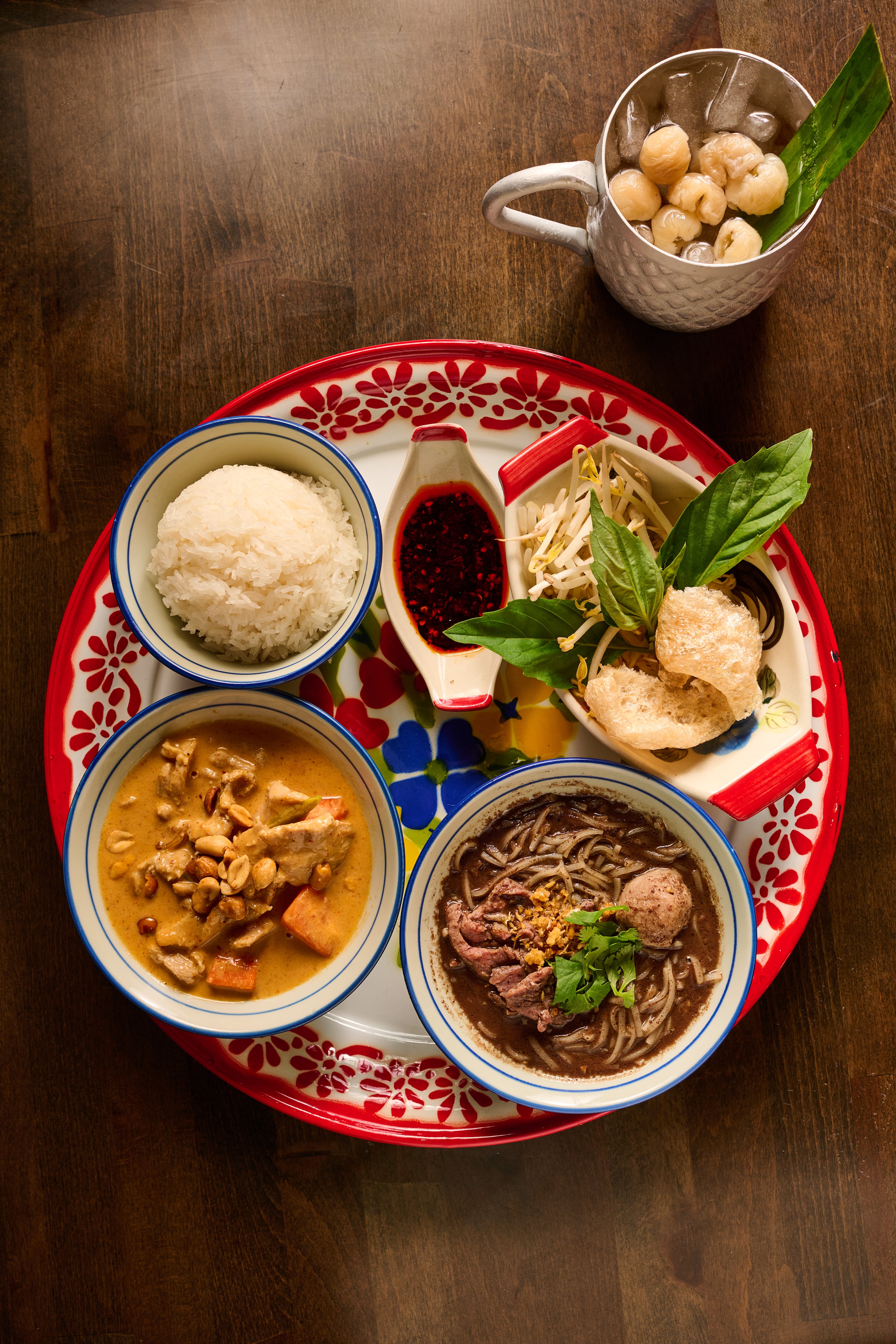 A tray of entrees at Terminal 26, including massaman curry (bottom left) and boat noodles (bottom right). (Angie Webb, courtesy of Terminal 26)