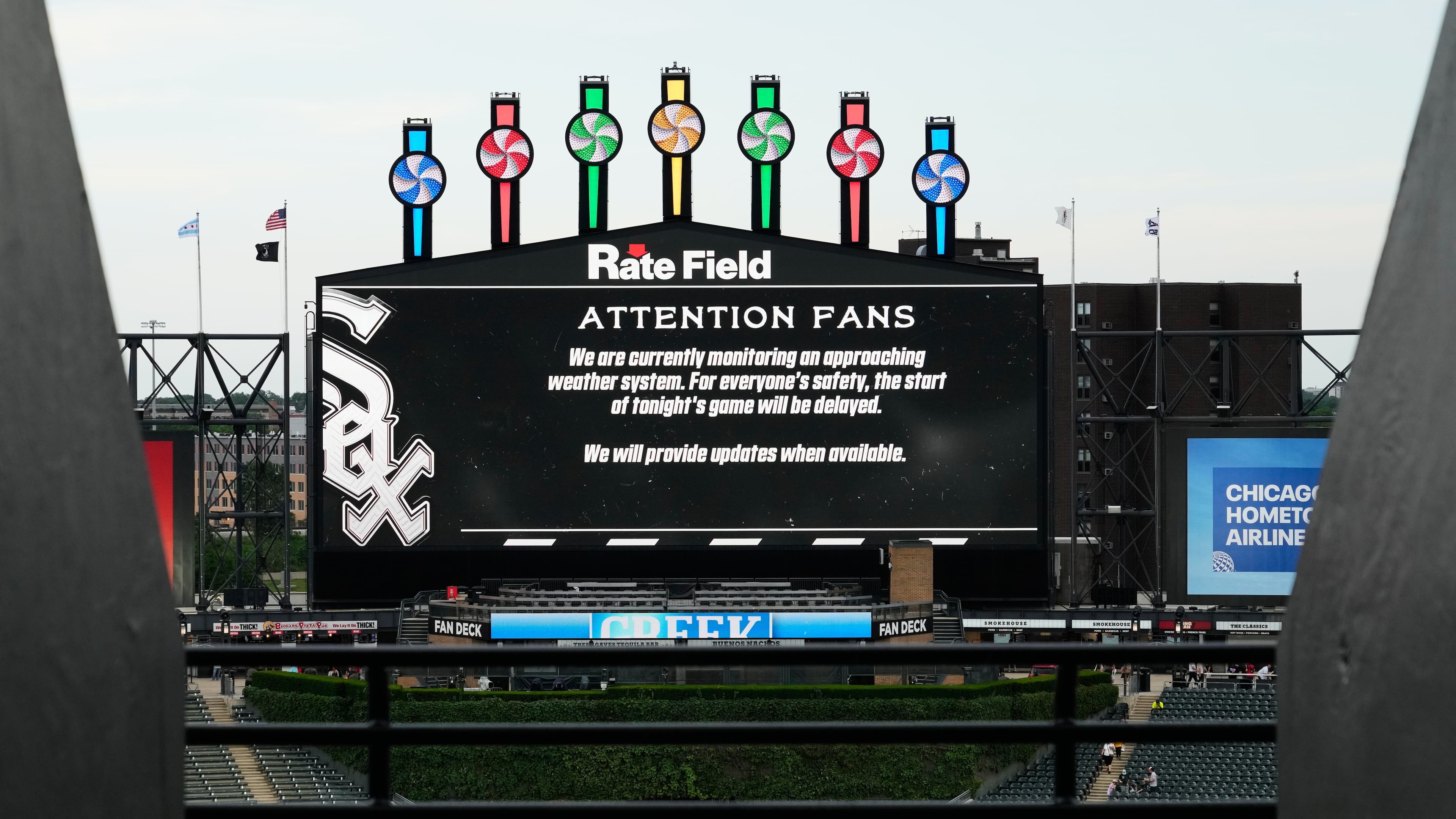 Information about rain delay displays on the big screen during a rain delay before a baseball game between the Atlanta Braves and the Chicago White Sox in Chicago, Thursday, June 11, 2026. (Nam Y. Huh/AP)