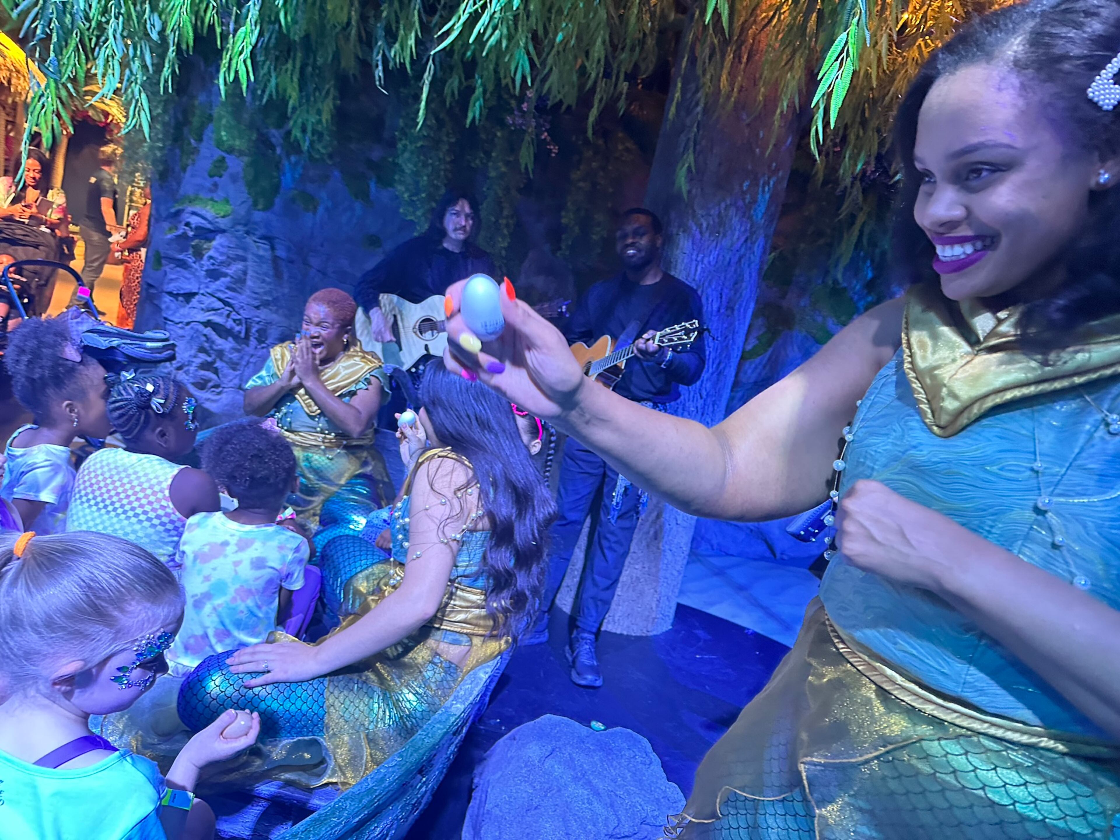"The Little Mermaid" experience at the CAMP store features songs from the movie sung by actors like Brittani Minnieweather (right). RODNEY HO/rho@ajc.com
