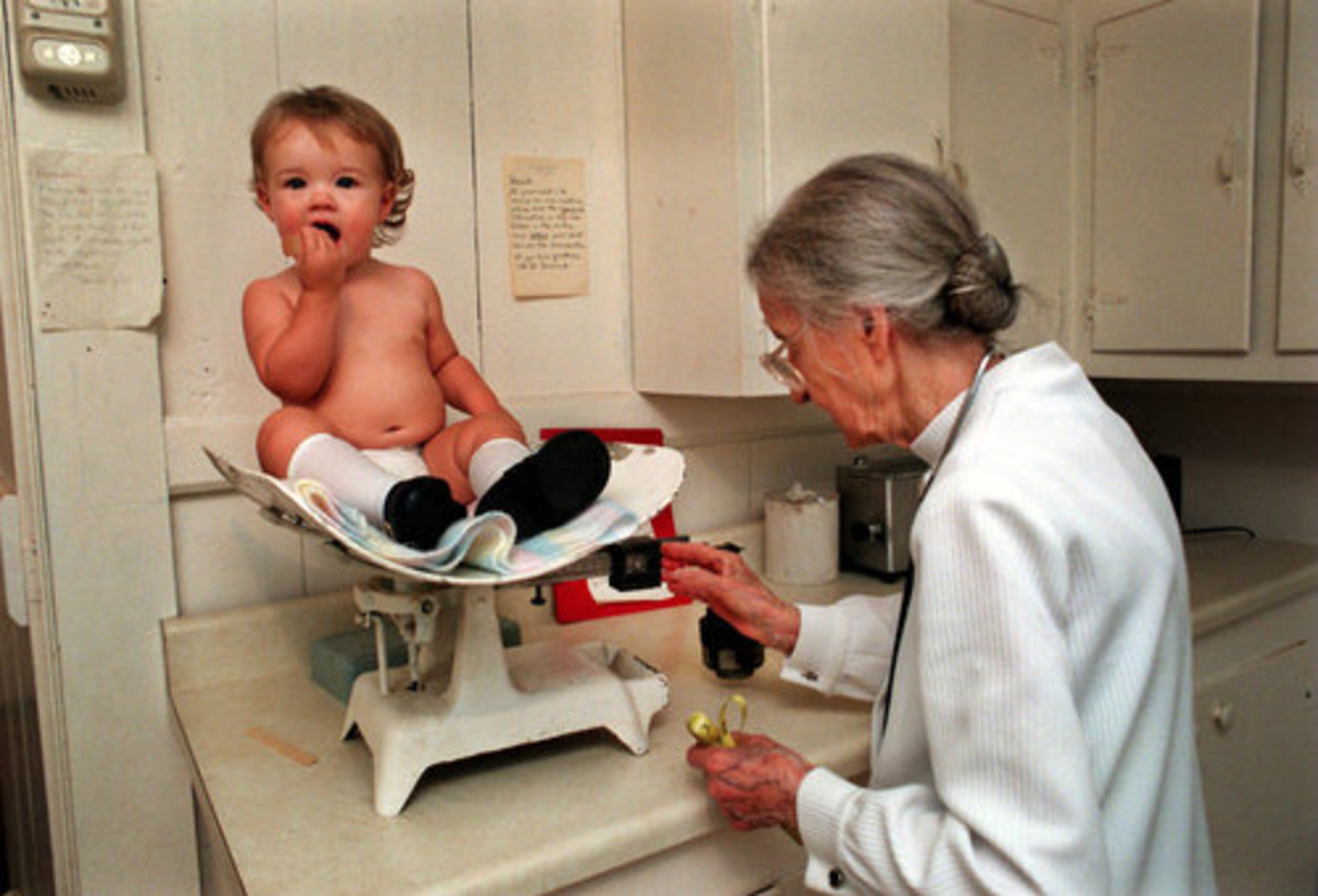 Denmark weighs 14-month-old Amber Jimison, of Buckhead in 1998. Denmark had planned to retire in 1985 when she moved to Forysth county from Sandy Springs where she'd practiced for 40 years, but continued to practice medicine until she was 103.