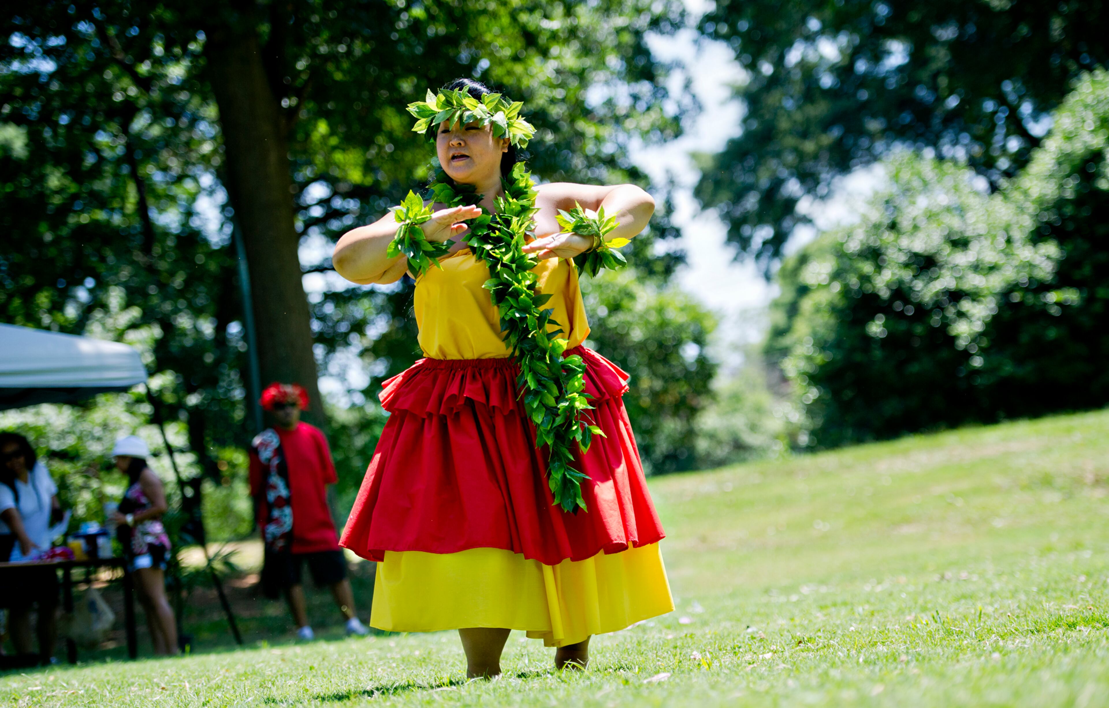 Mika Dickerson dances as she performs during the Nezian Festival at Grant Park in Atlanta on Saturday, July 5, 2014. The two day festival brought together the culture and traditions of the South Pacific Islands with dance and music performances, food and local merchants.