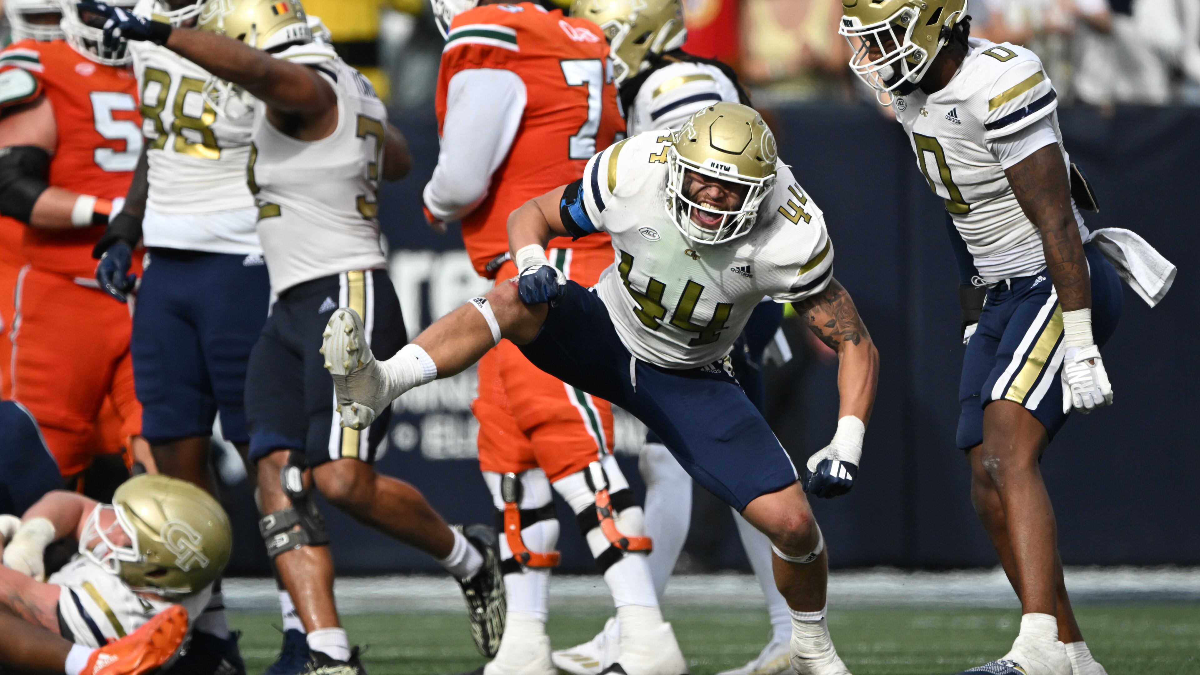 Georgia Tech linebacker Kyle Efford (44) celebrates after sacking Miami quarterback Cam Ward during the second half of an NCAA college football game at Georgia Tech's Bobby Dodd Stadium, Saturday, November 9, 2024, in Atlanta. Georgia Tech won 28-23 over Miami. (Hyosub Shin / AJC)
