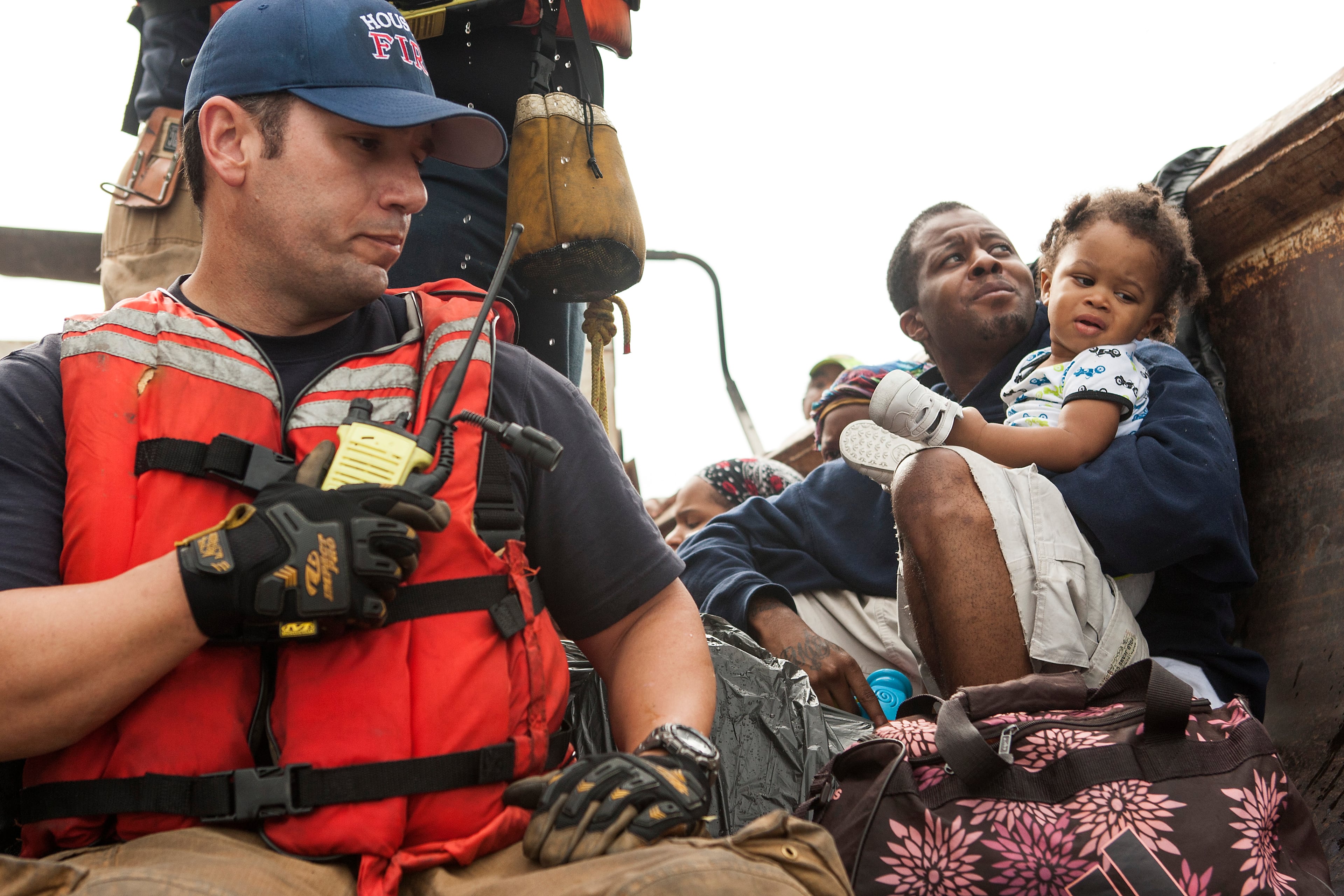 Residents of the Arbor Court apartments evacuate their flooded apartment complex in the Greenspoint area Monday, April 18, 2016, in The Woodlands, Texas. (Brett Coomer/Hoston Chronicle via AP)