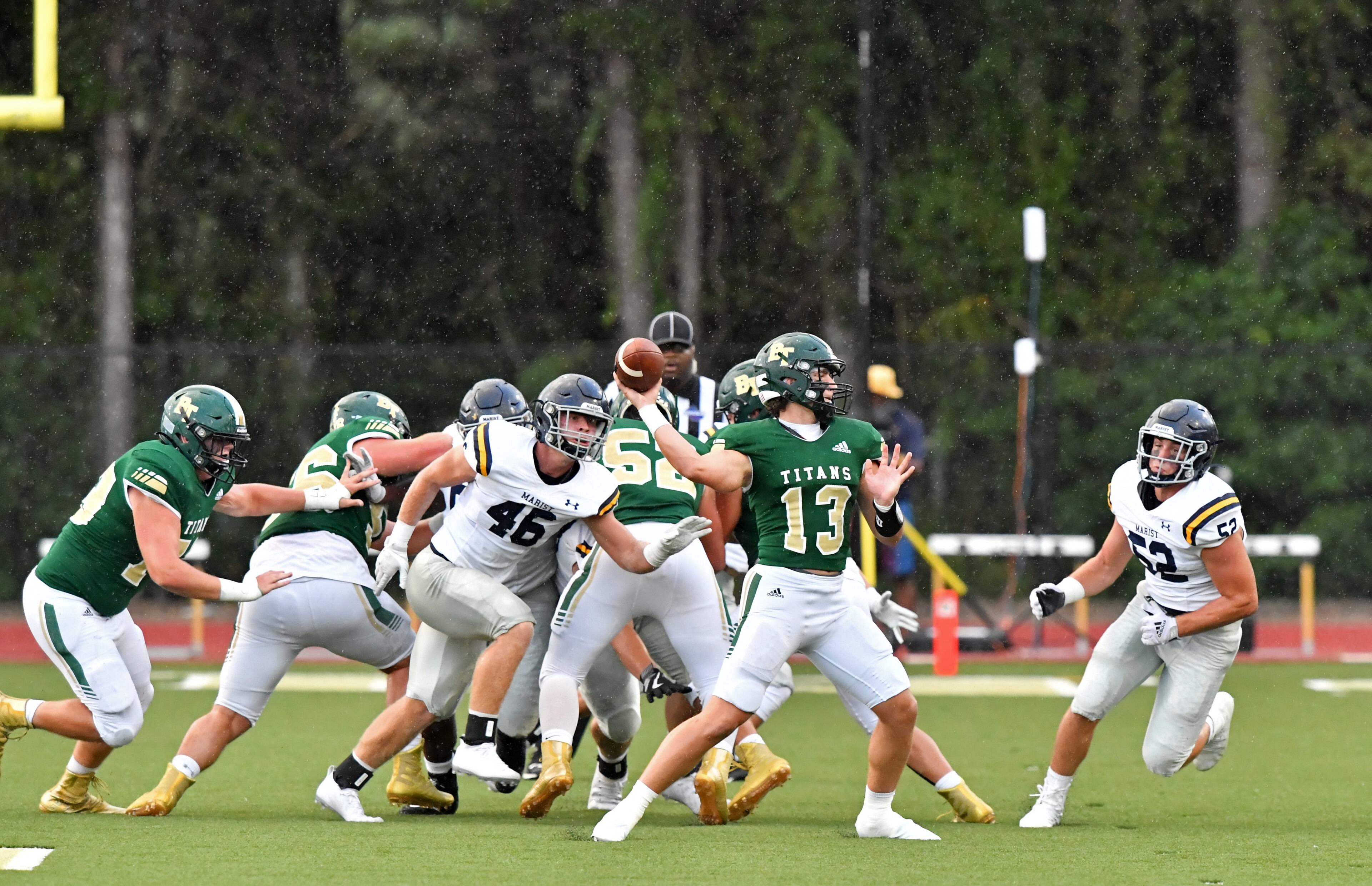Blessed Trinity quarterback JC French (13) throws a pass in the first half. (Hyosub Shin / Hyosub.Shin@ajc.com)