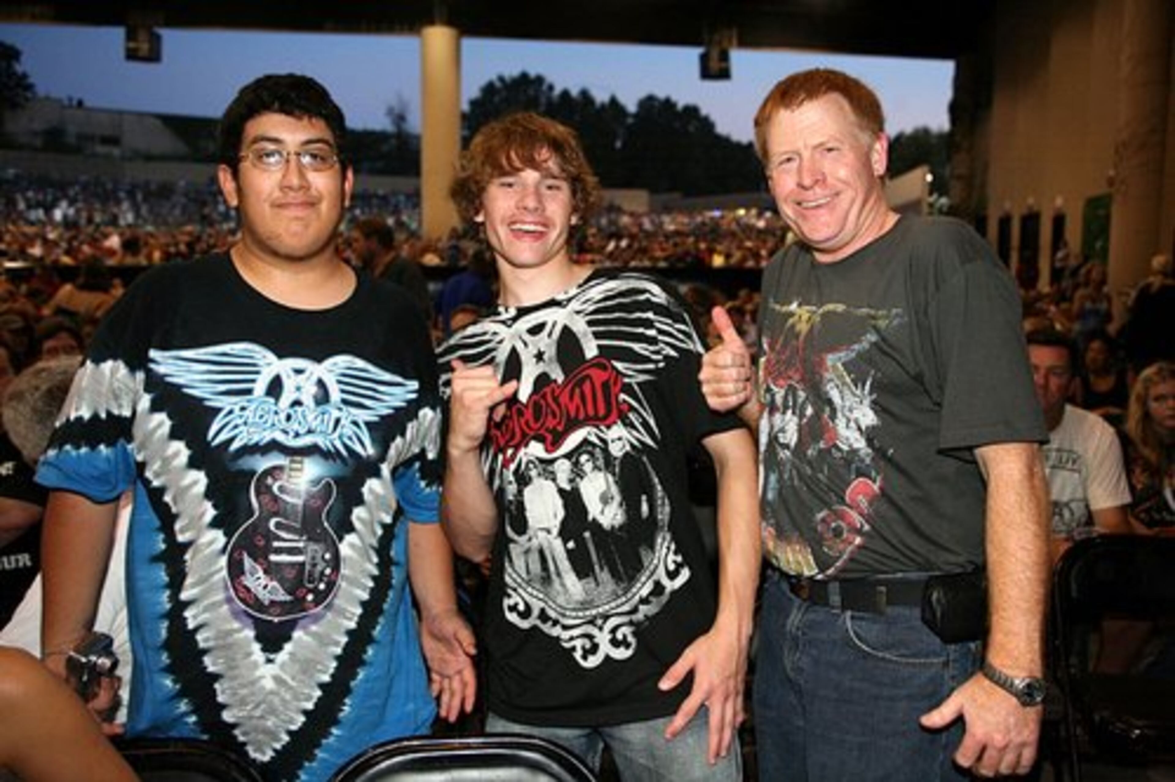 Love of Aerosmith spans the generational divide for fans Danny Ruales-Ortiz, Logan O'Connell and Jim O'Connell.