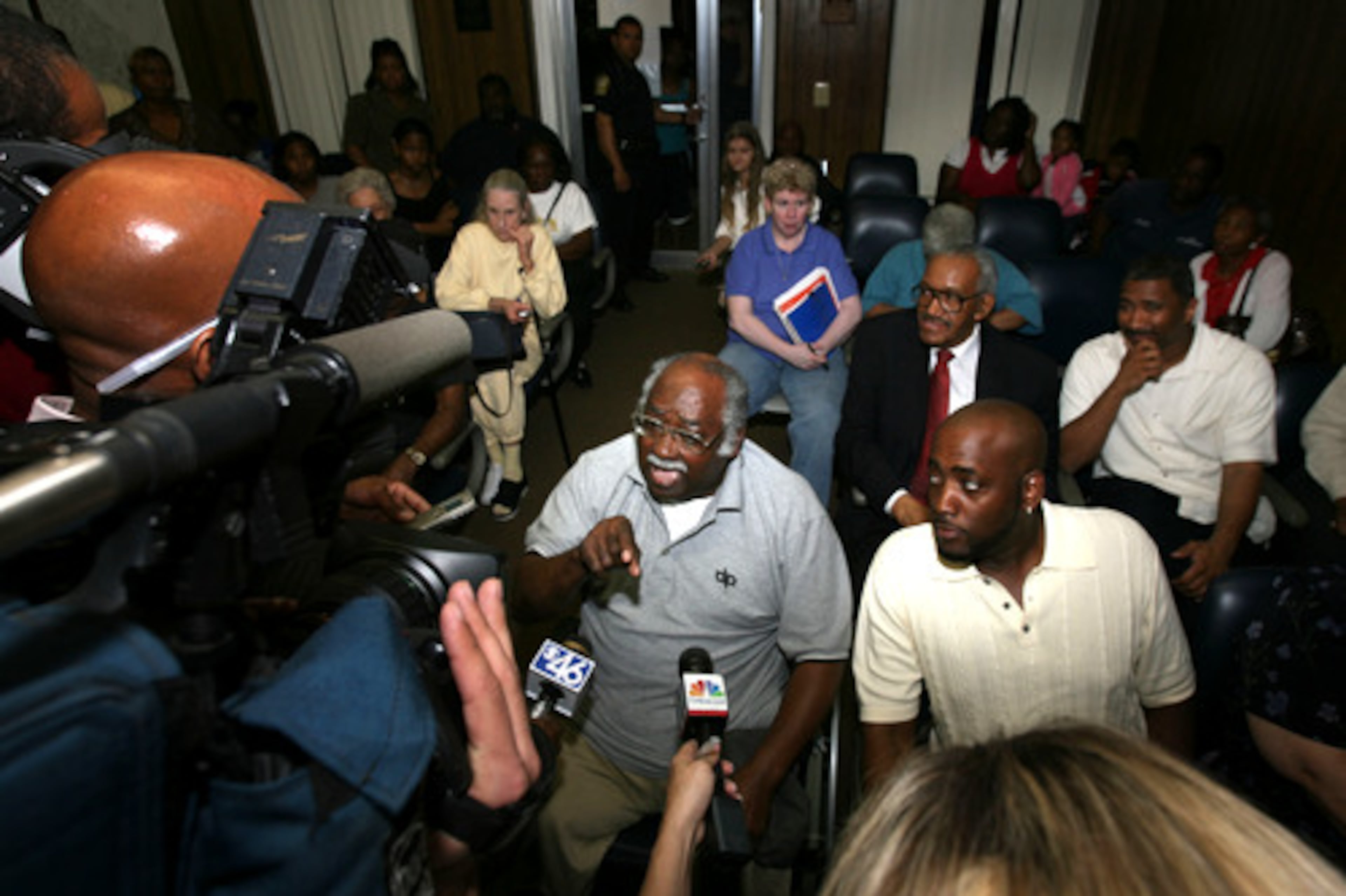 But residents weren't ready to go. Johnny Daugherty, a resident of Lithonia for seventy-one years, talks with reporters as a room full of people remain after city council members exited its chambers.