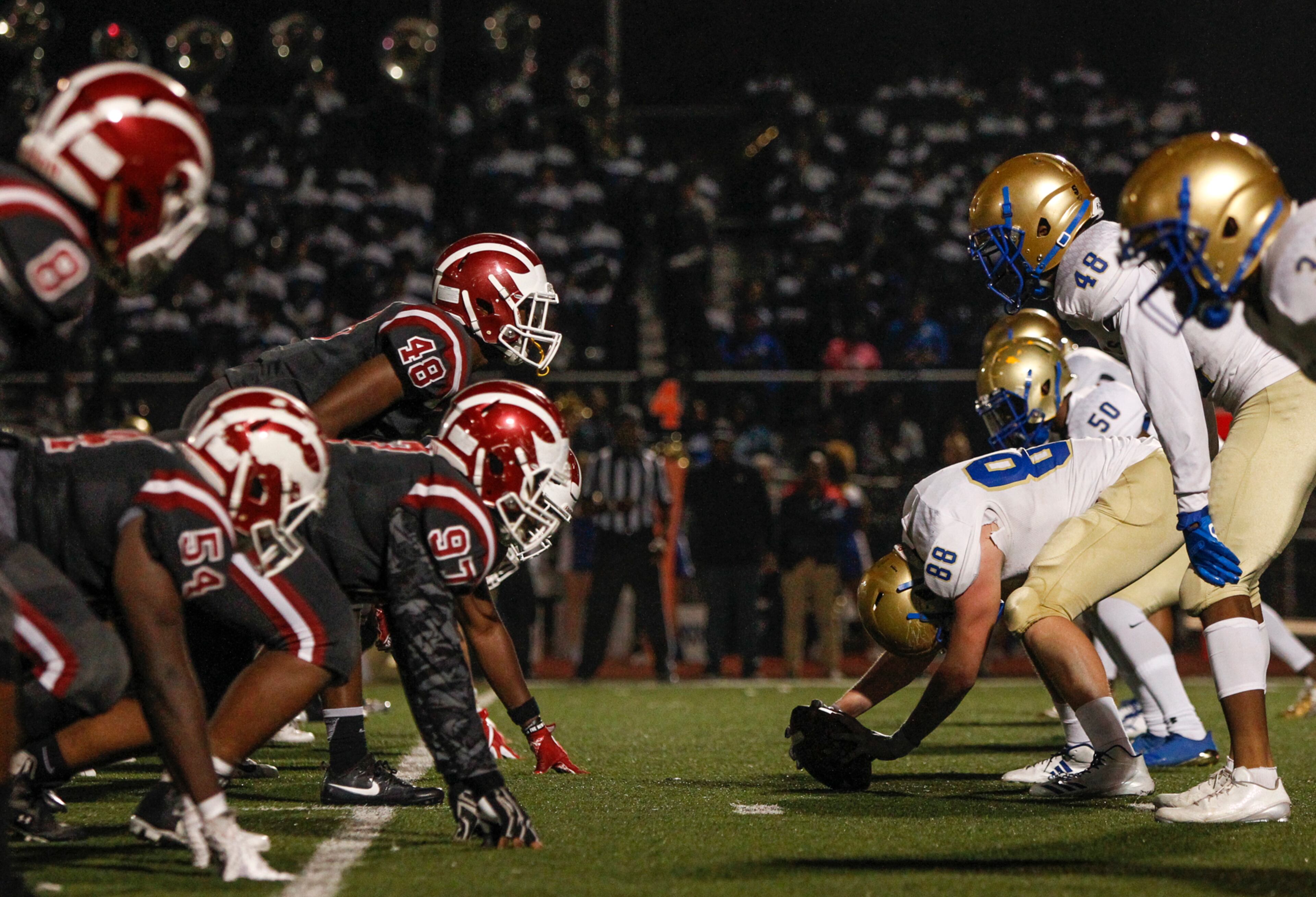 Hillgrove and McEachern players line up during the first half of a high school football game between the McEachern Indians and the Hillgrove Hawks at Hillgrove High School in Powder Springs, Georgia, on Friday, Nov. 3, 2017. (CASEY SYKES, CASEY.SYKES@AJC.COM)