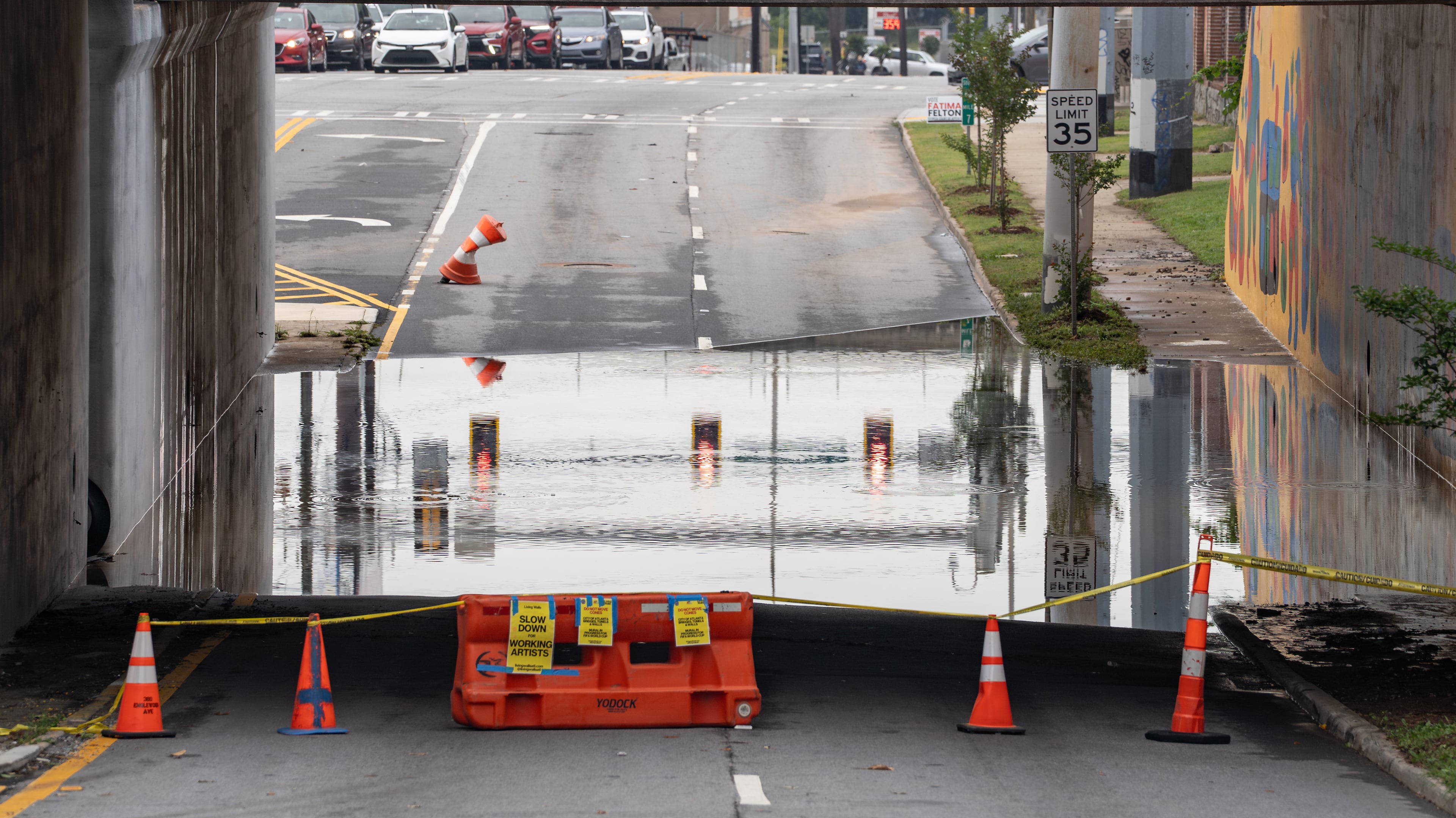 The southbound side of Northside Drive near Whitehall Street in Atlanta remains closed because of standing water Thursday morning after rain showers Wednesday. North Georgia will see more rain in the coming days, possibly causing more flooding. (Ben Hendren for the AJC)