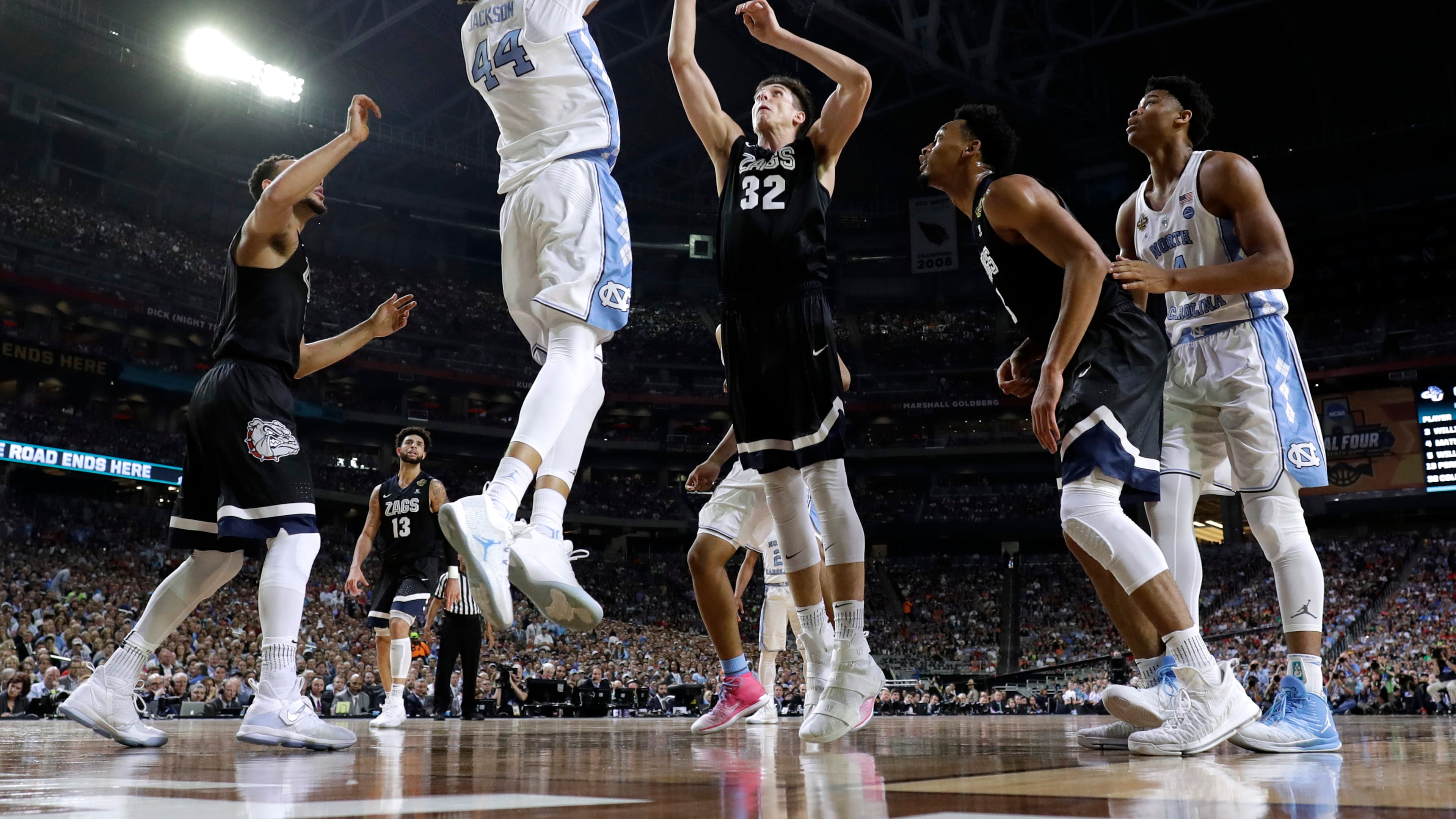 North Carolina forward Justin Jackson (44) shoots over Gonzaga forward Zach Collins (32) during the first half in the finals of the Final Four NCAA college basketball tournament, Monday, April 3, 2017, in Glendale, Ariz. (AP Photo/Mark Humphrey)